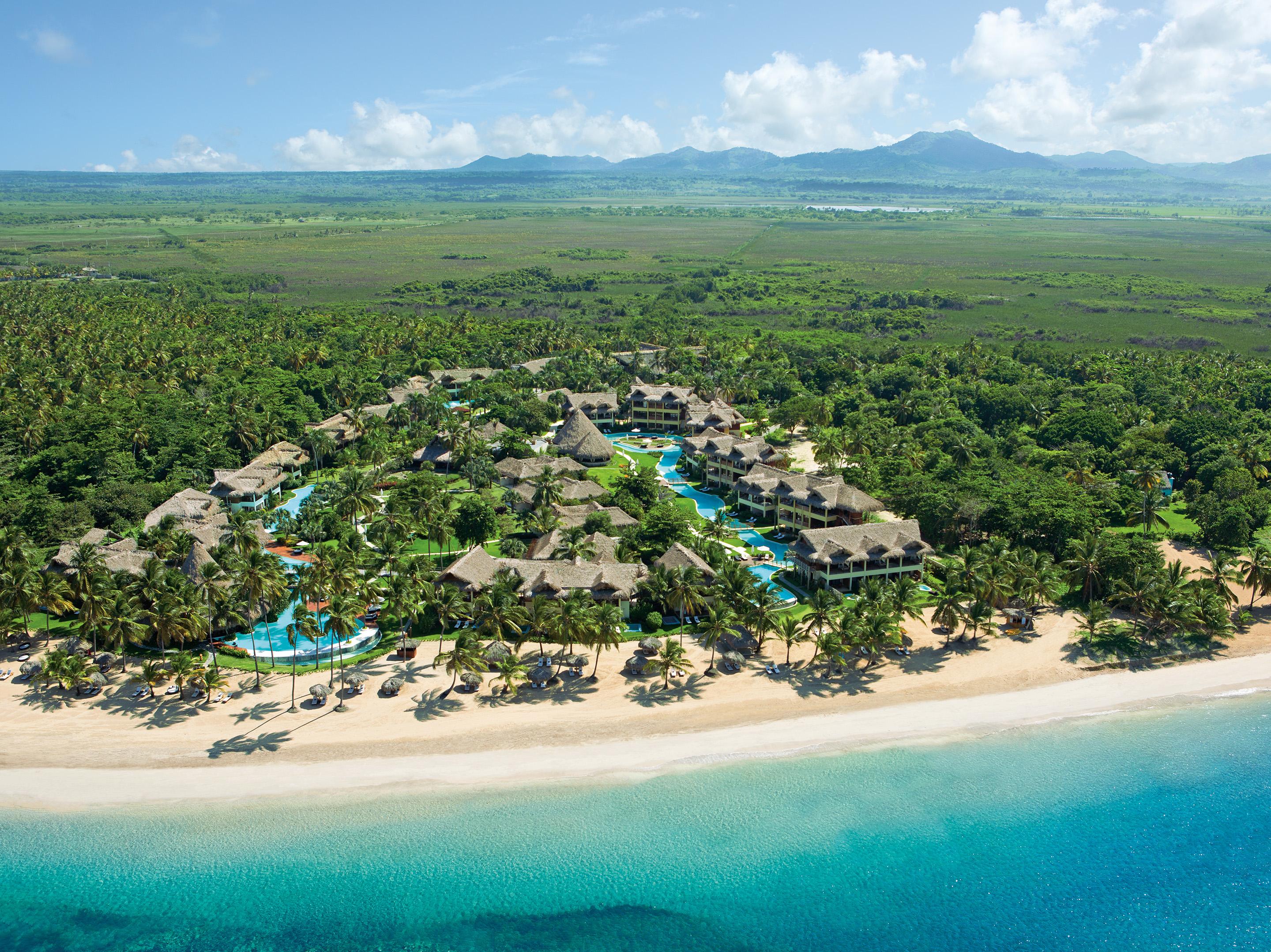 ZoÃ«try Agua Punta Cana aerial view of thatched palapas and Uvero Alto beach