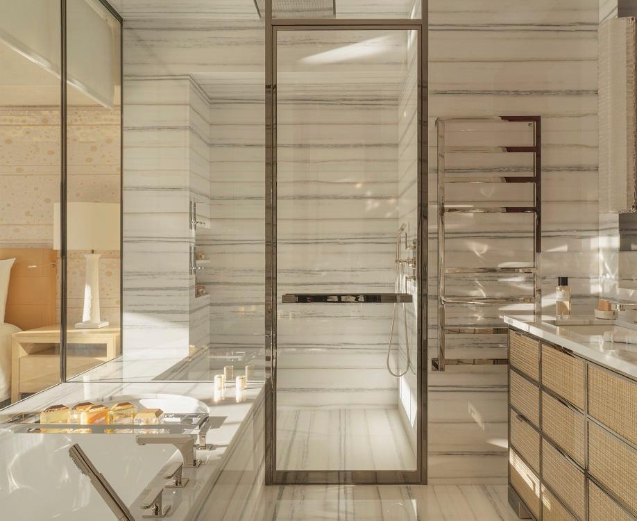 Honey-veined marble bathroom with walk-in hammam shower