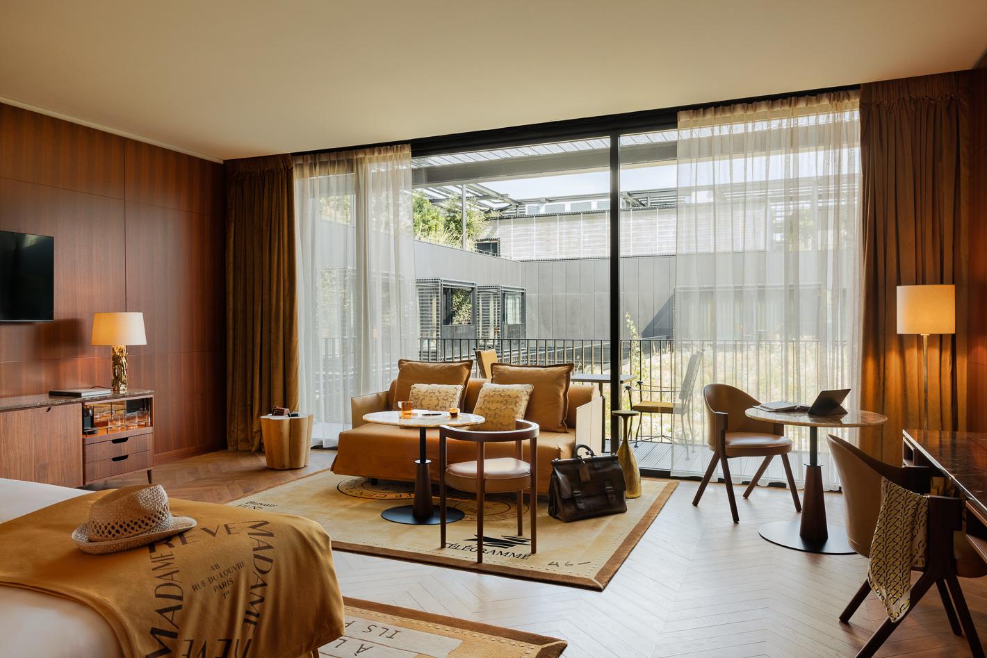 Garden Suite at Hotel Madame Reve featuring private terrace suspended above lush greenery