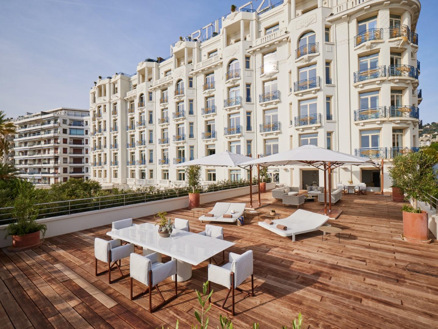 Expansive private terrace of the Suite des Oliviers overlooking Cannes and the Mediterranean