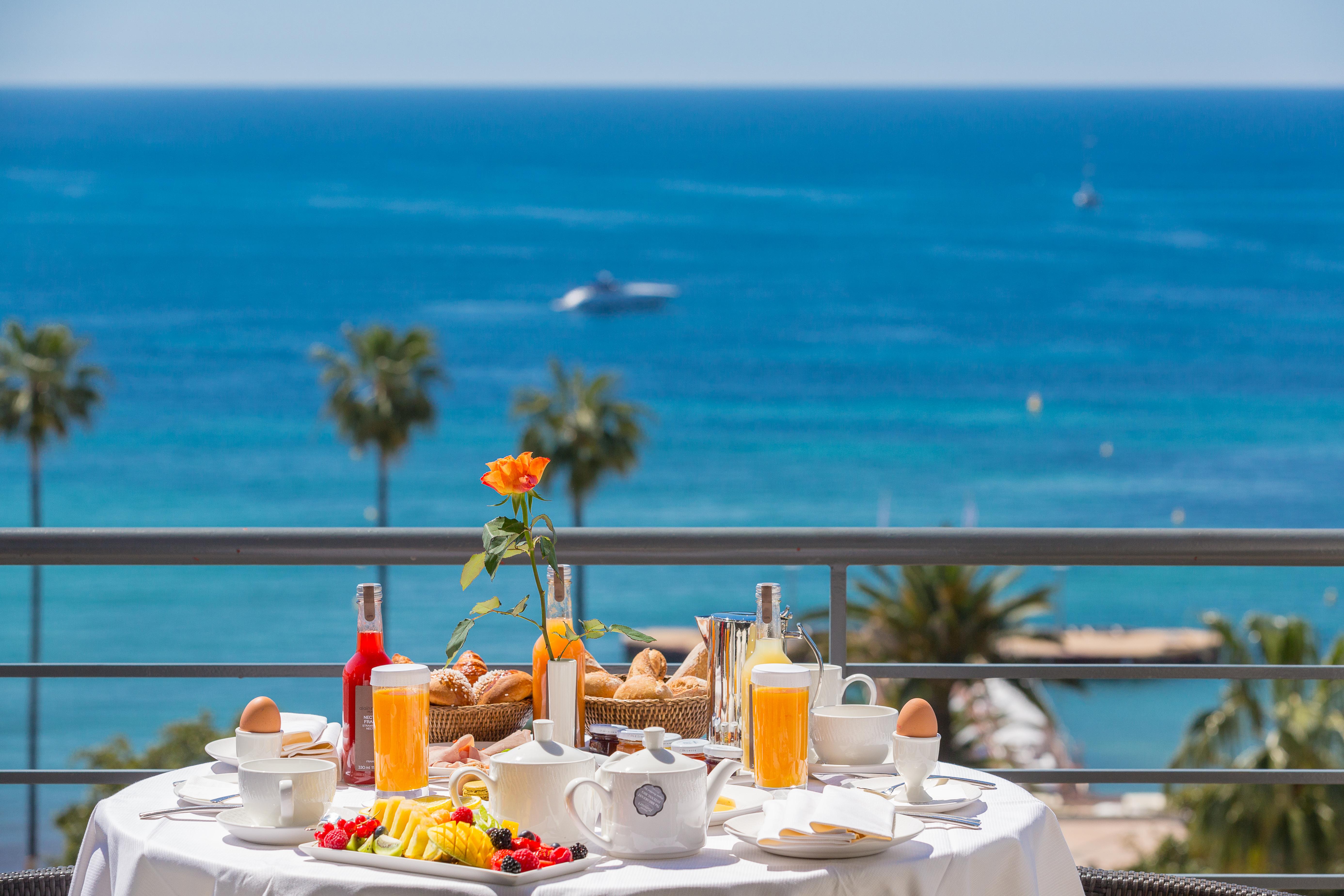 Ciros Cannes private beach club and overwater pier on the Mediterranean Sea