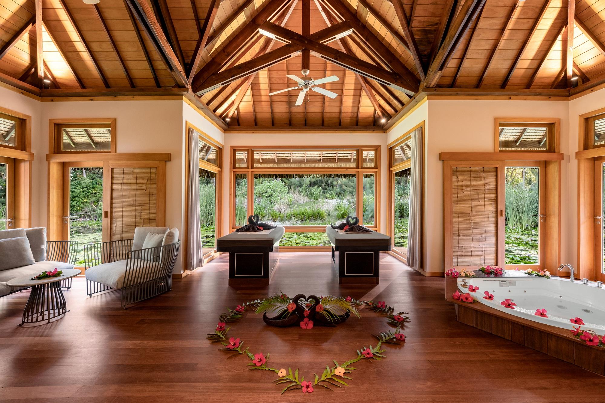 Tavai Spa open-air Polynesian treatment suite in lush garden canopy