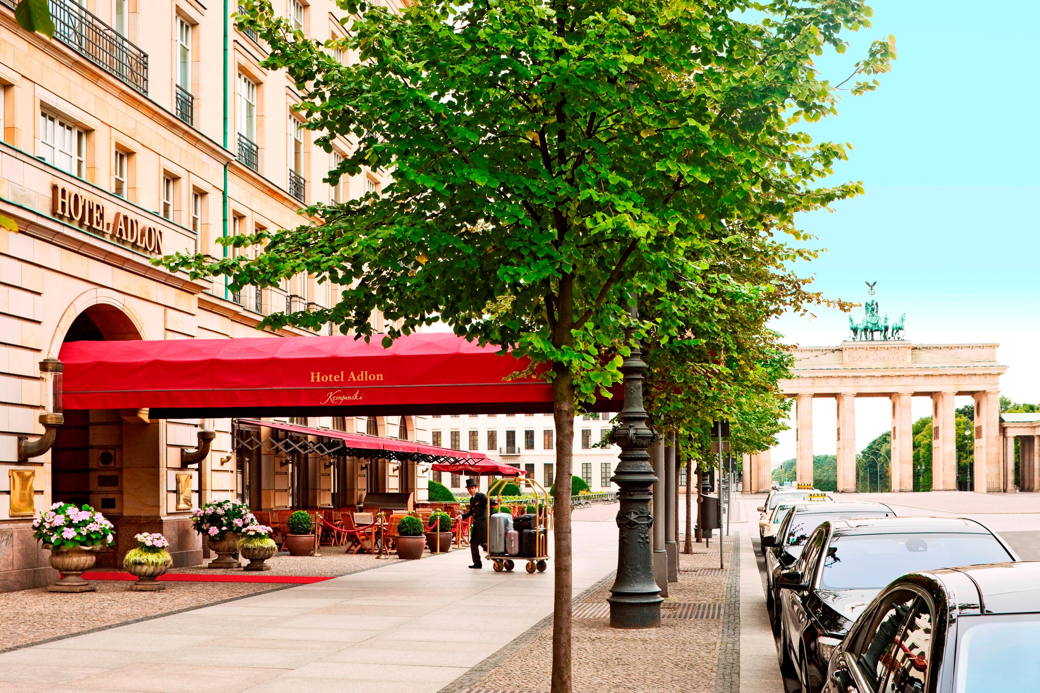 Hotel Adlon Kempinski red carpet grand entrance with head concierge