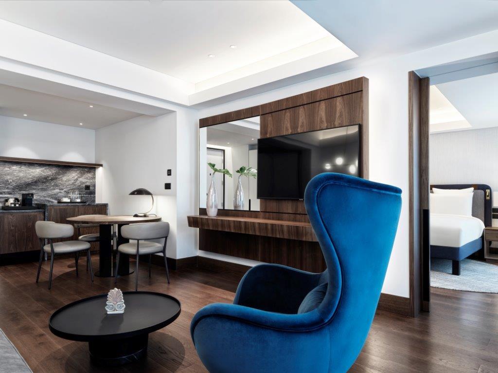 Executive Suite featuring Cycladic lines, Grecian marble, and bespoke contemporary art