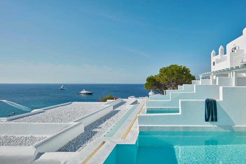 Myconian Ambassador Seafront Infinity Pool Deck and Sun Loungers Overlooking Platis Gialos