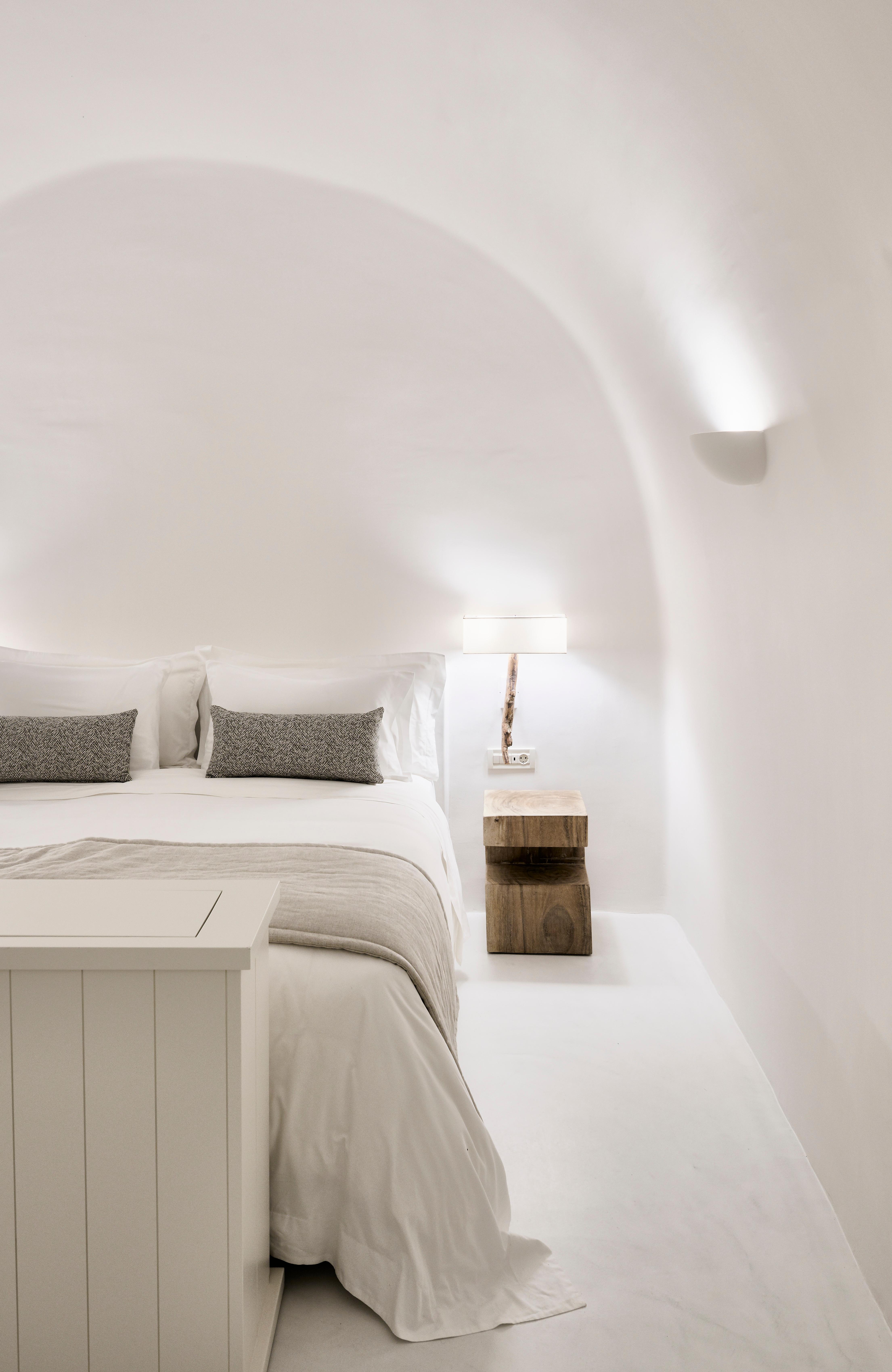 Aura Suite Newly Renovated Cycladic Cave Bedroom with Natural Earth Tones and King Bed