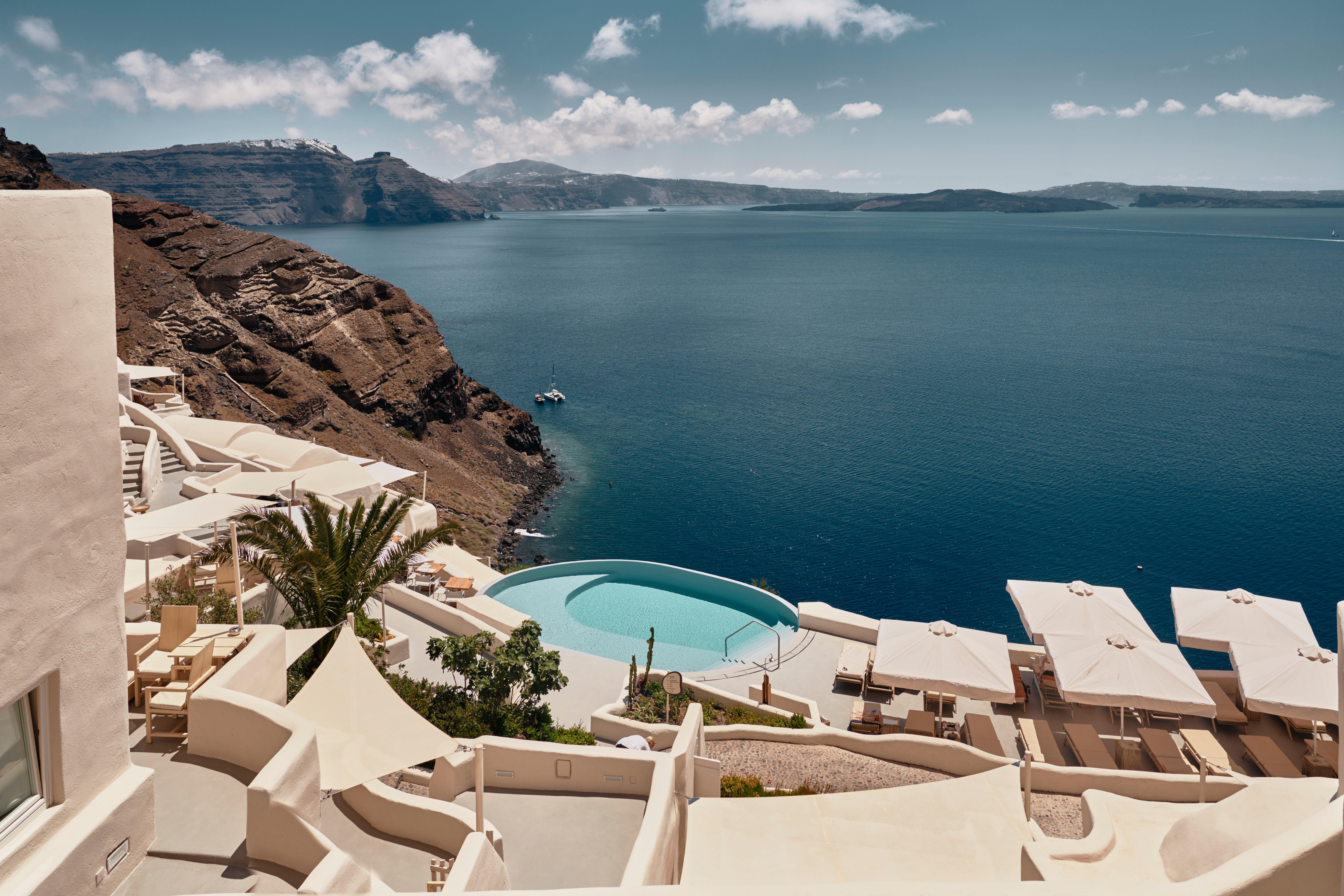 Mystique Santorini Cliffside Infinity Pool and Sunbeds Suspended Over Oia Caldera