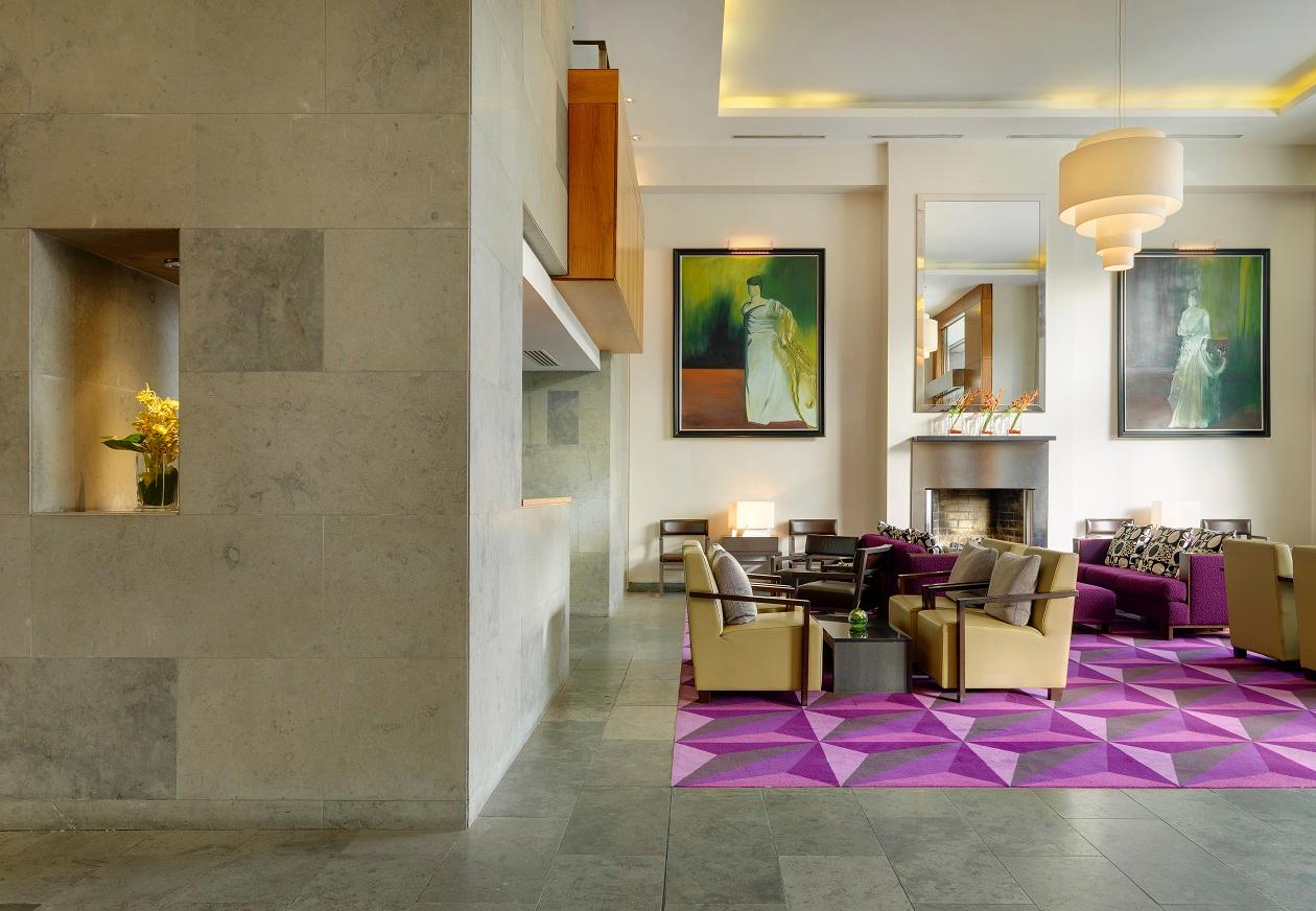 Conran-Designed Hotel Lobby with Vibrant Contemporary Art and Fireside Seating