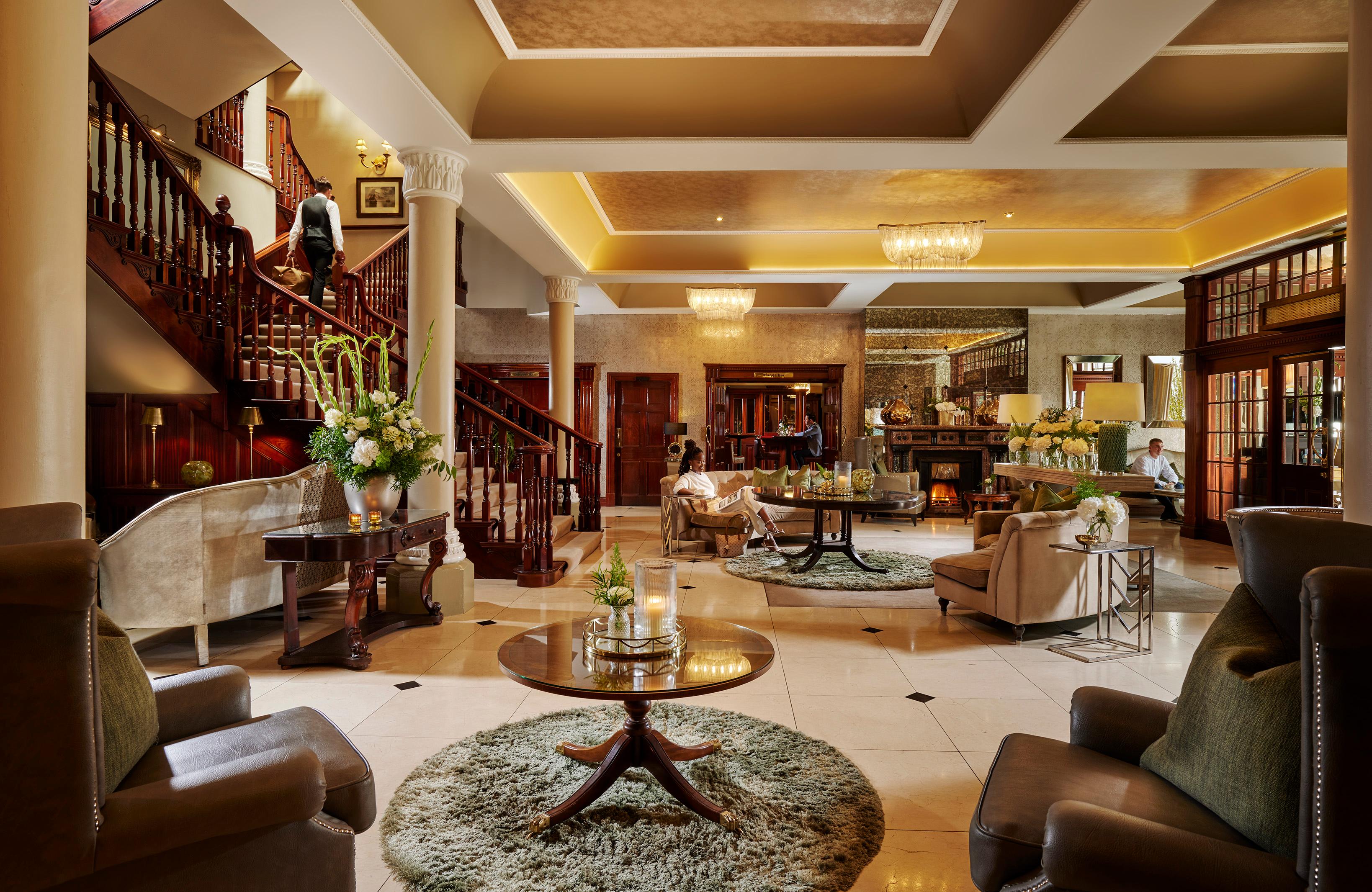Hayfield Manor Grand Reception Lobby with Antique Furnishings and Open Fireplaces
