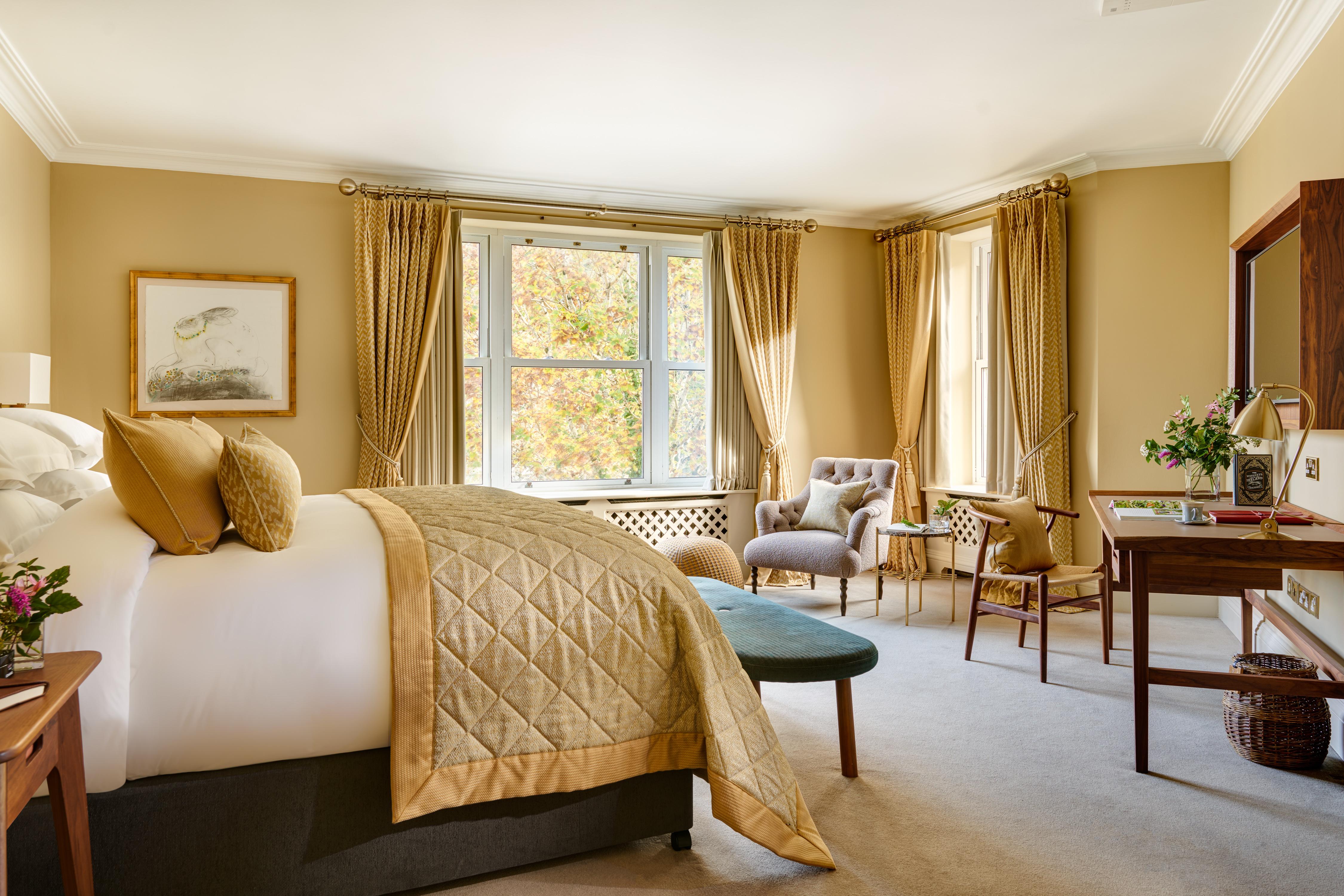Falls View Suite bedroom with panoramic views of the cascading river