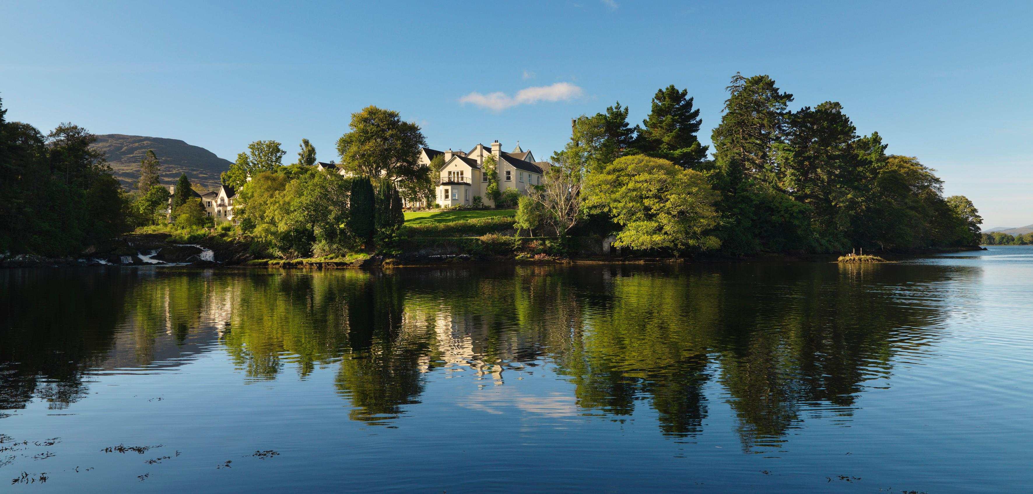 Sheen Falls Lodge manor façade overlooking the cascading waterfalls of the River Sheen