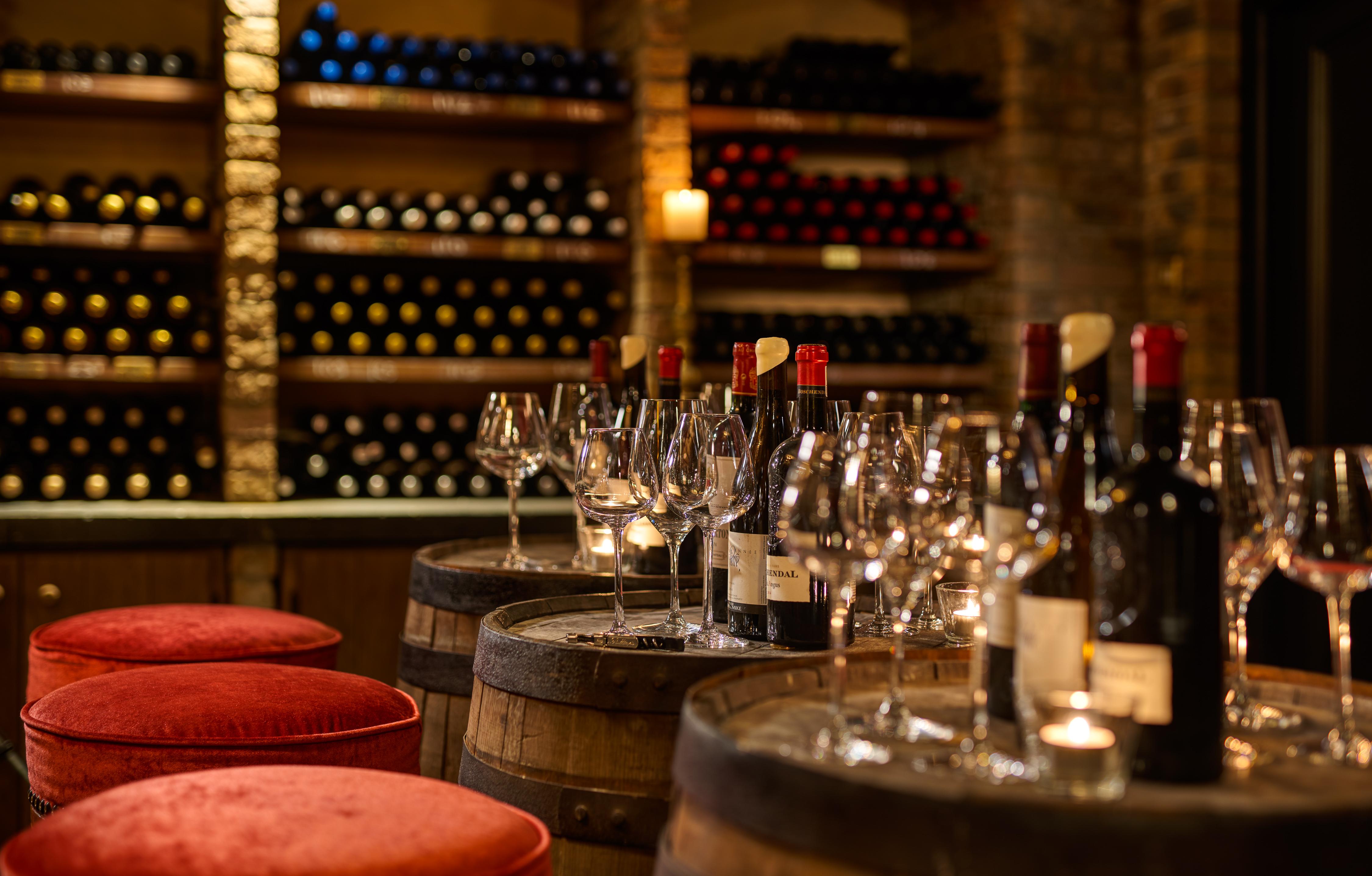 The historic subterranean wine cellar housing over 10,000 vintage bottles