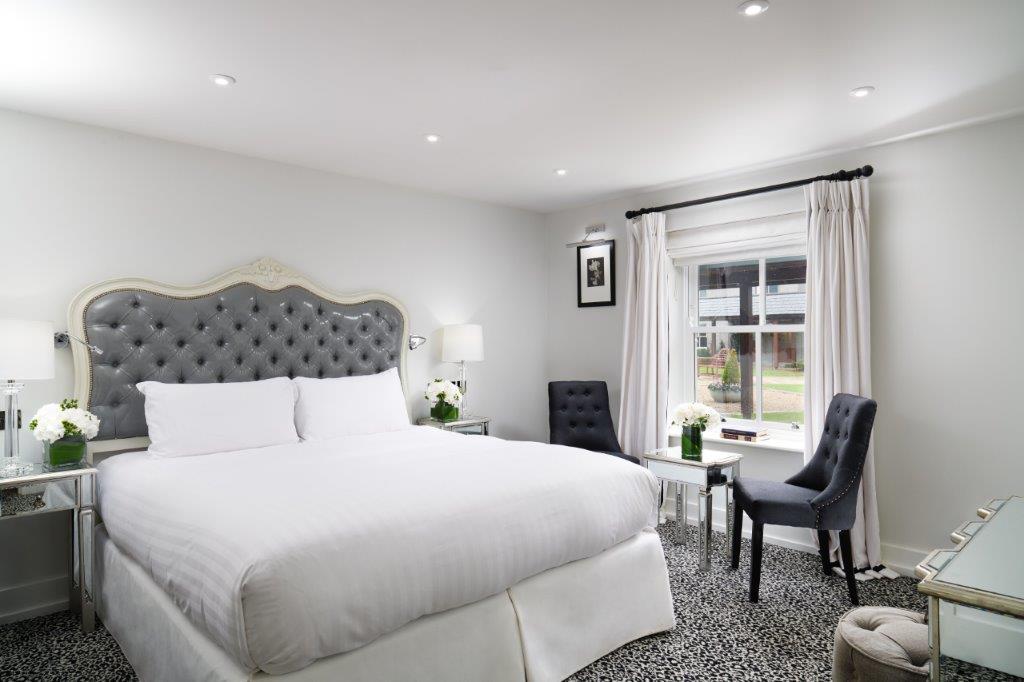 Deluxe Guestroom Featuring Elegant Contemporary Furnishings and Courtyard Views