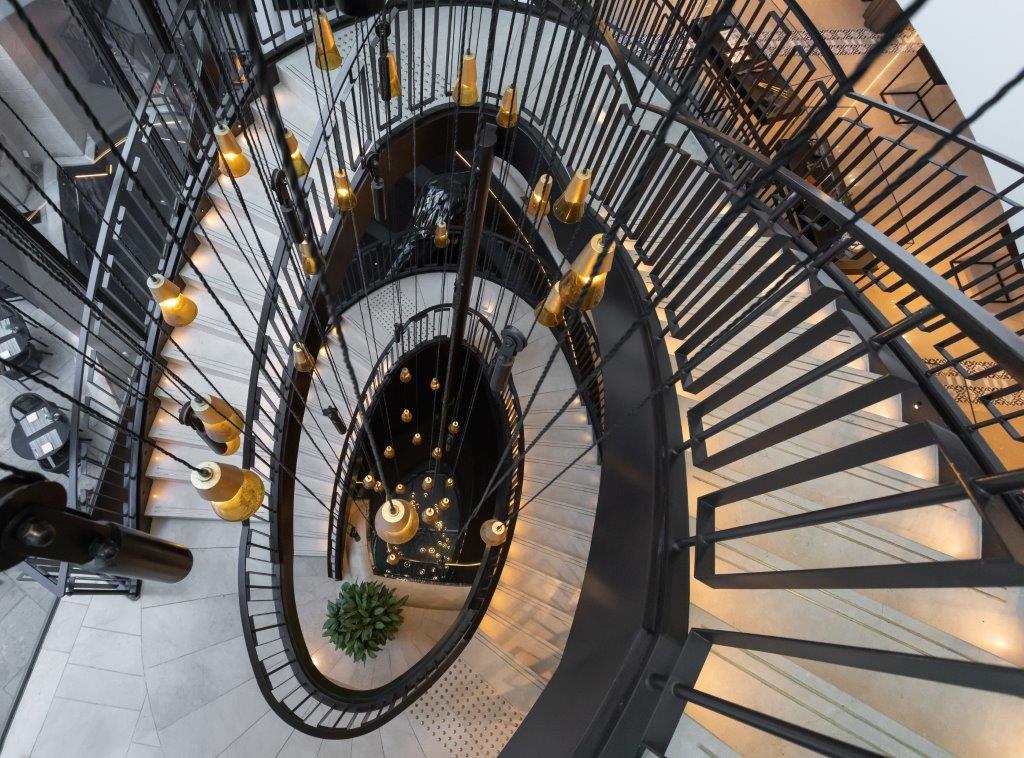 Grand Glass Atrium Lobby Blending Jerusalem Stone & Modern Art
