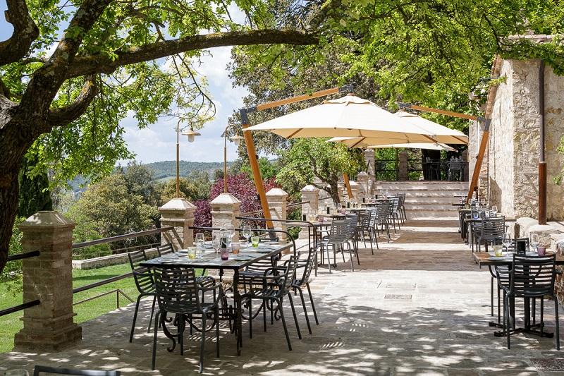 Trattoria Al Fresco Dining Under Wisteria Arbors Serving Wood-Fired Tuscan Gastronomy