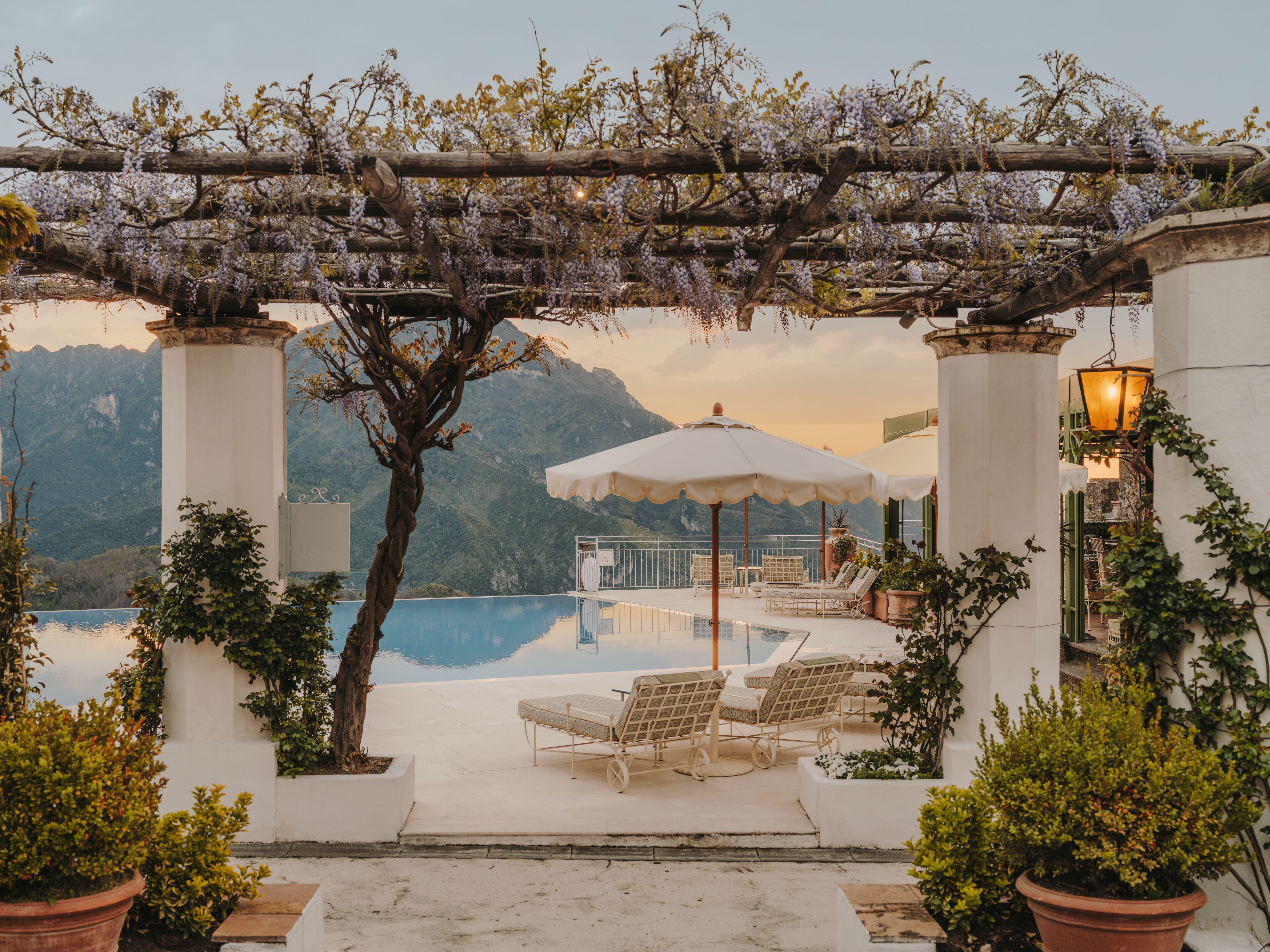 Iconic heated infinity pool at Caruso Belmond hovering above the Amalfi Coast in Ravello