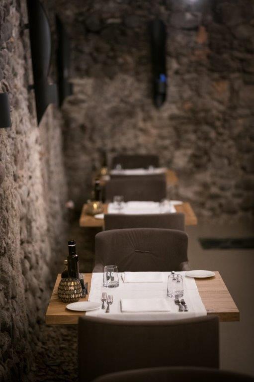 Vaulted stone cellar dining room at Le Segrete