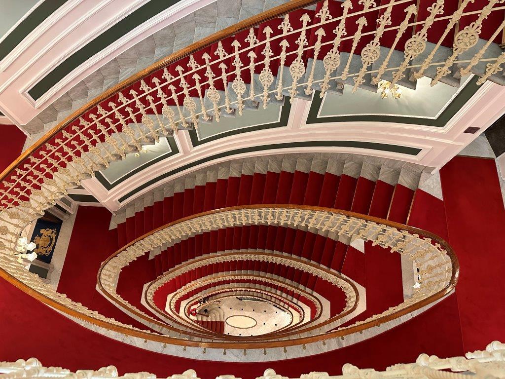 Monumental Elliptical Marble Staircase Inspiring Hitchcock