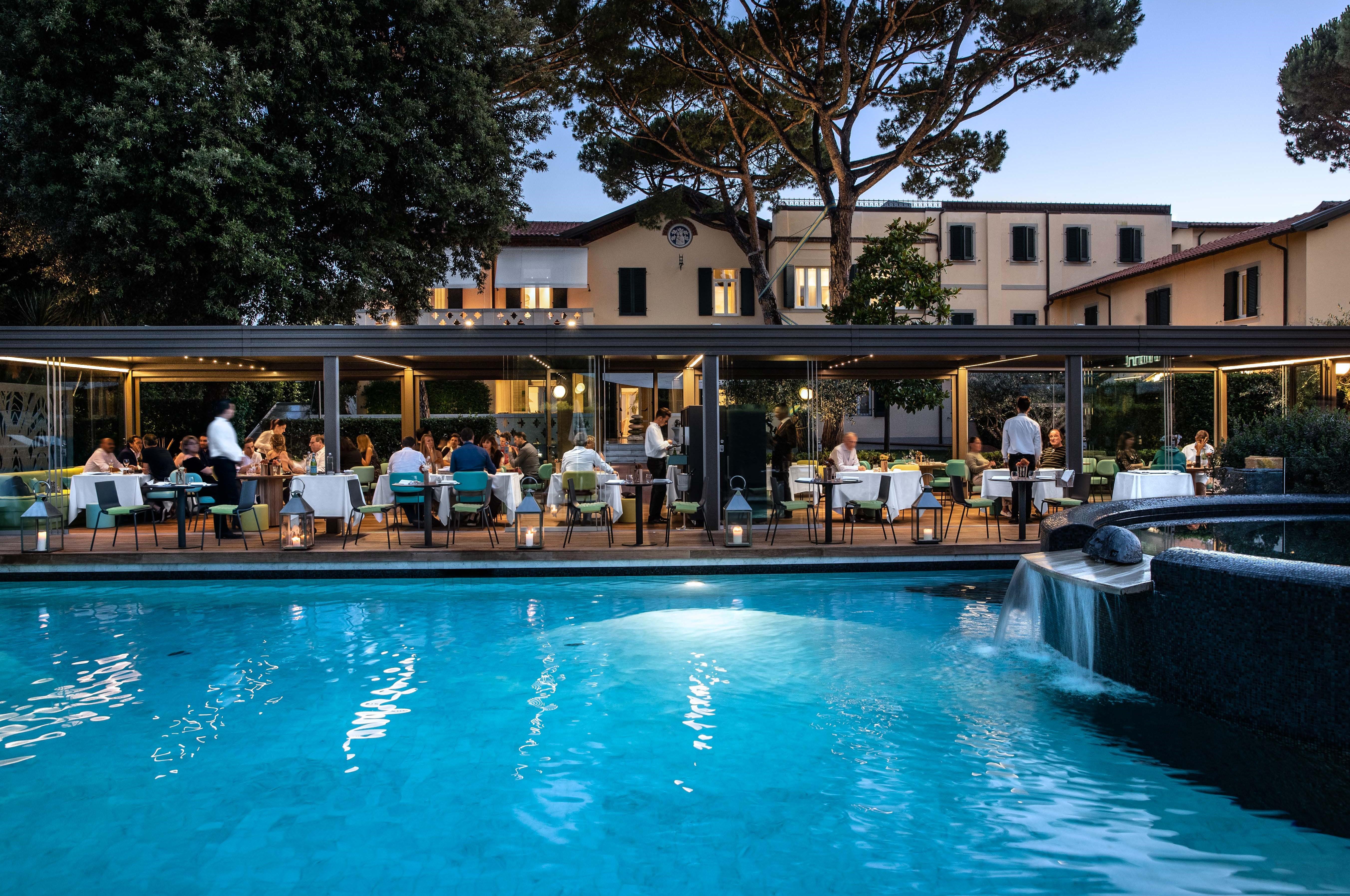 Romantic Candlelight Dinner Setup around Garden Pool at La Magnolia