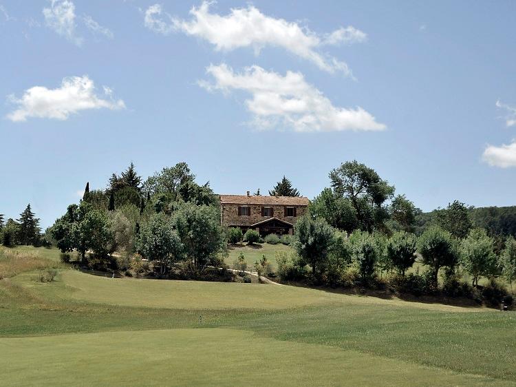 Trattoria La Stellata stone farmhouse overlooking golf course
