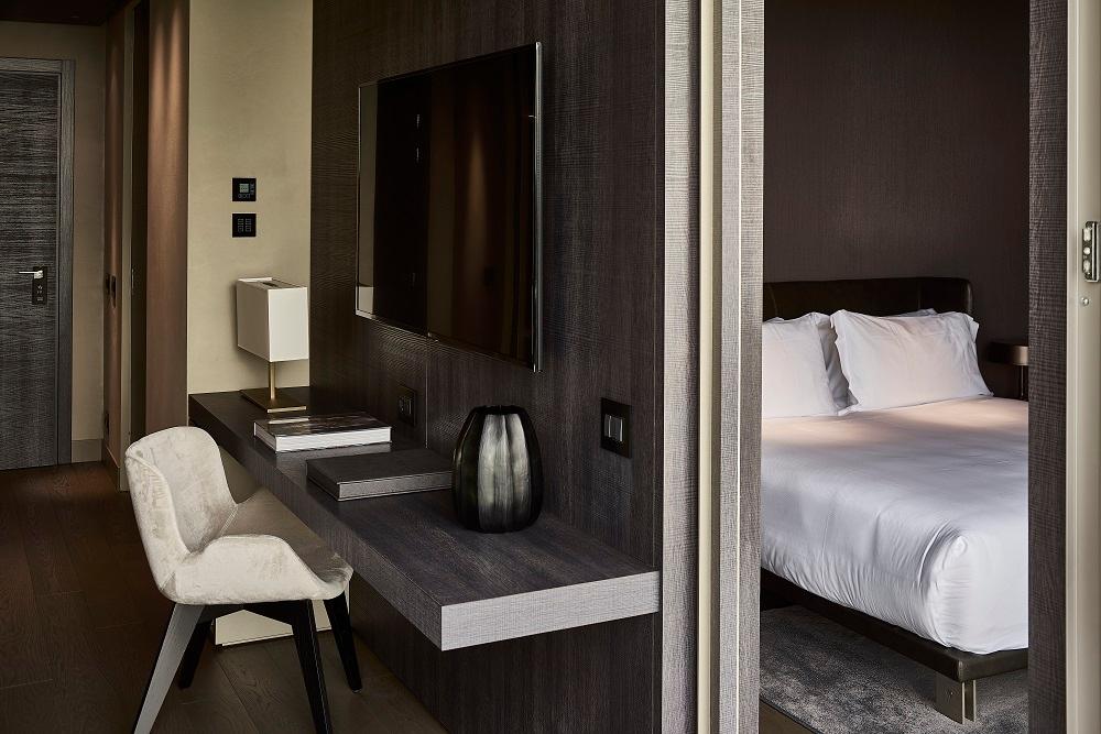 Balcony Suite bedroom opening onto private furnished terrace