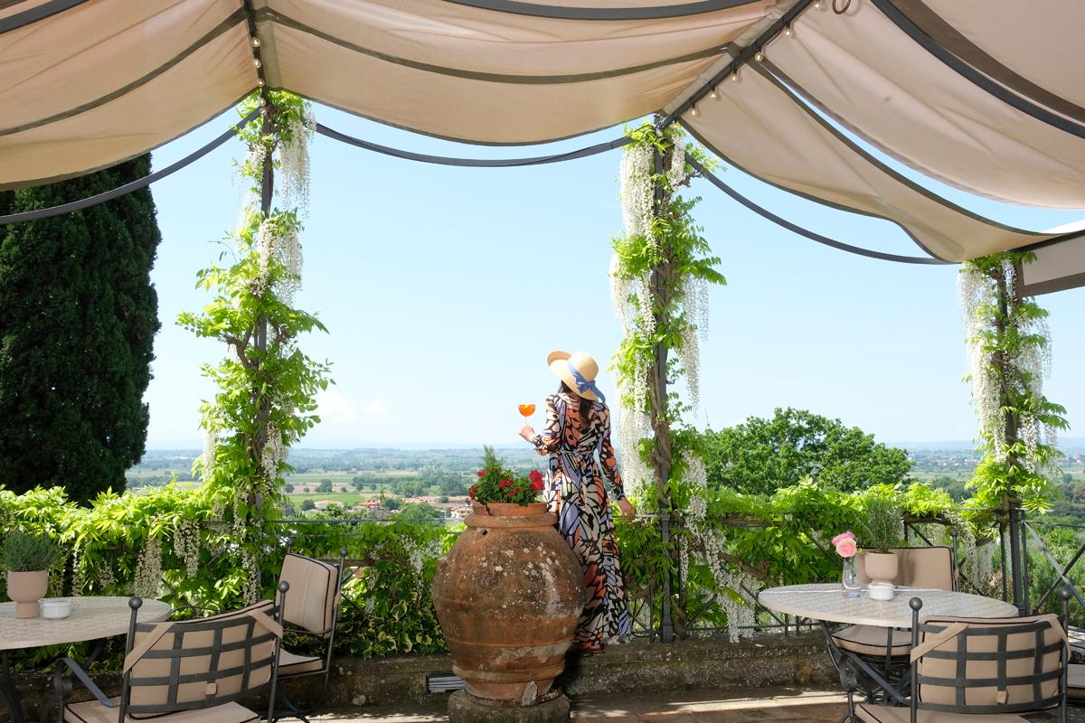 Al fresco dining terrace overlooking olive groves and Tuscan hills