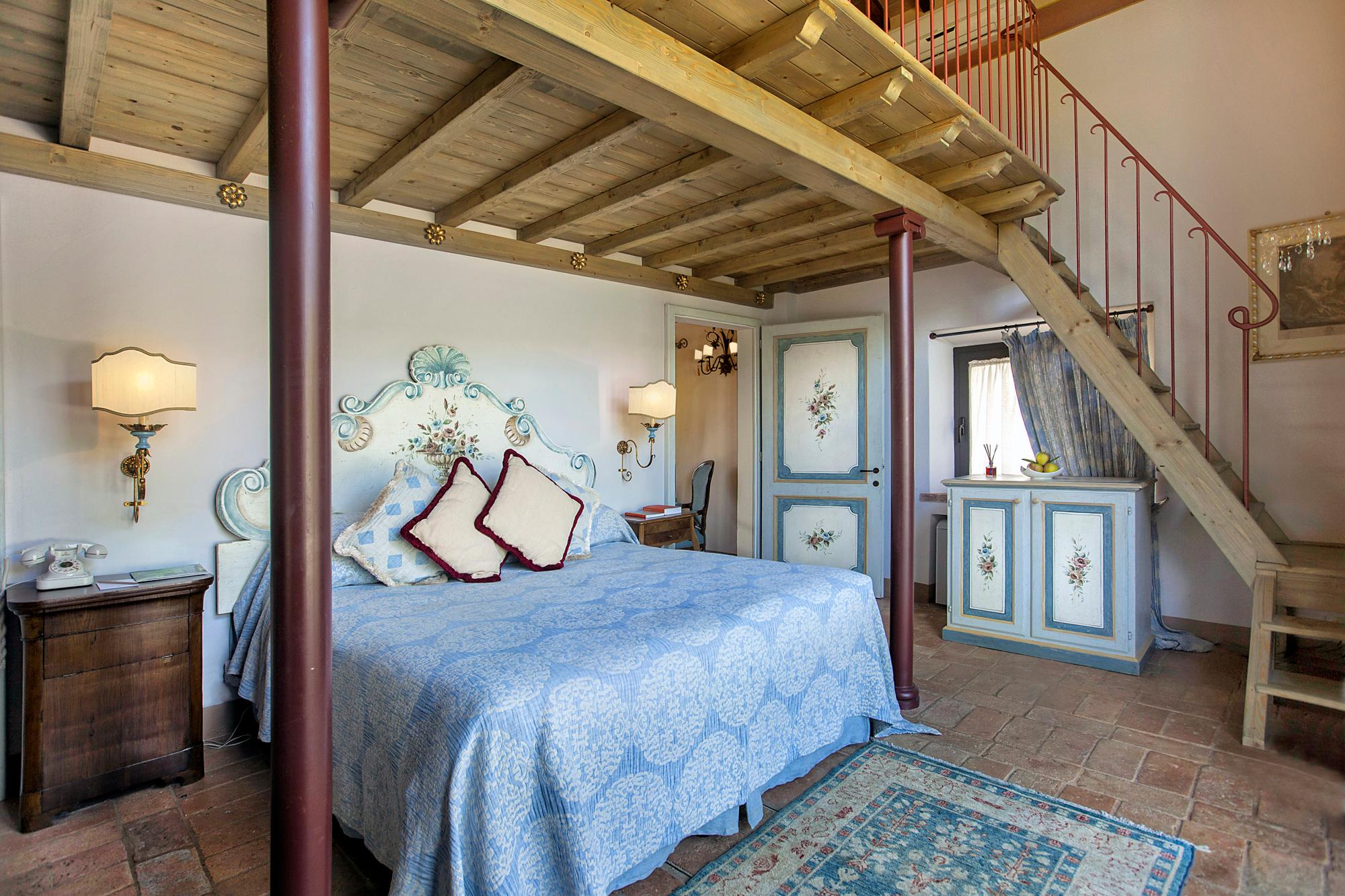 Winery Master Suite with bespoke Tuscan furnishings and vineyard vistas
