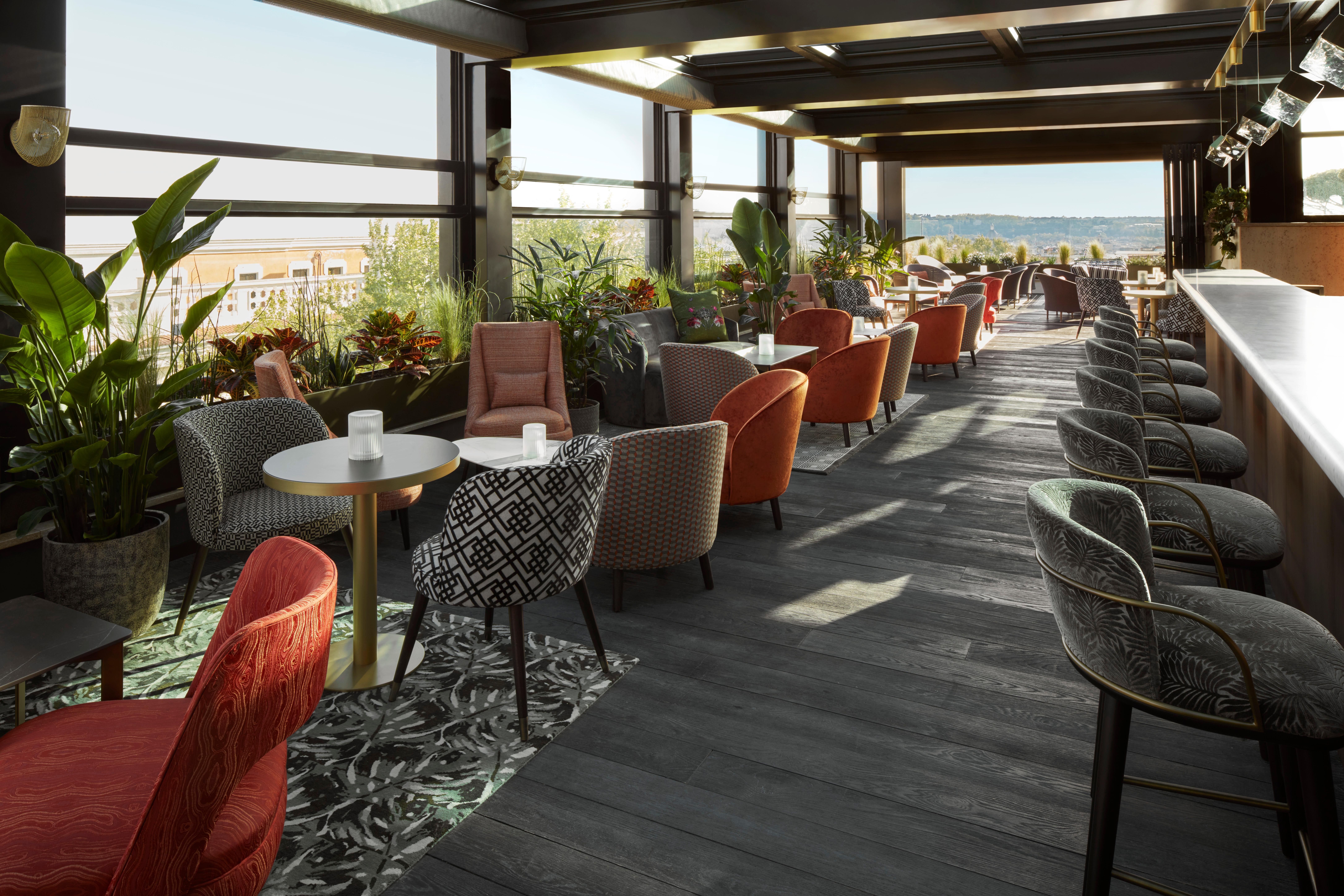 Charlie's Rooftop Bar and terrace offering signature cocktails and panoramic Rome skyline views
