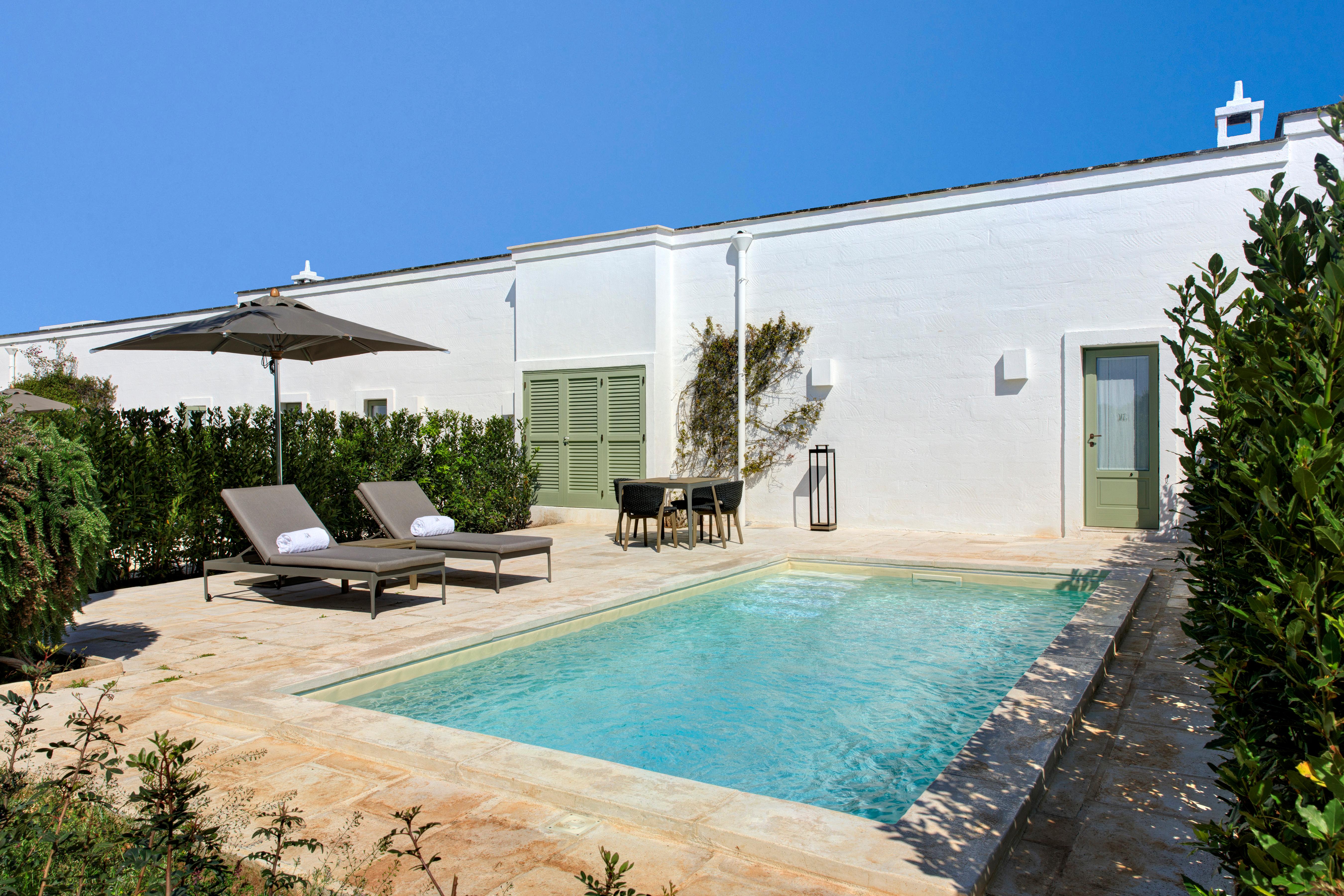 Deluxe Suite with private garden and outdoor heated plunge pool amidst olive trees