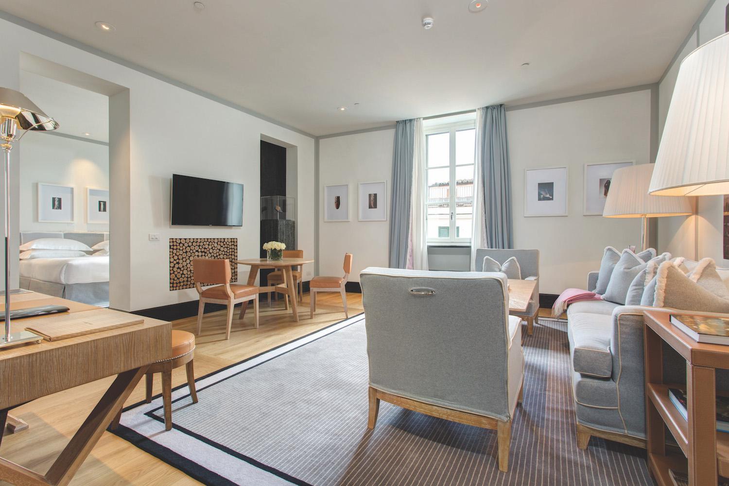 Portrait Roma Deluxe Studio bedroom featuring curated vintage photography