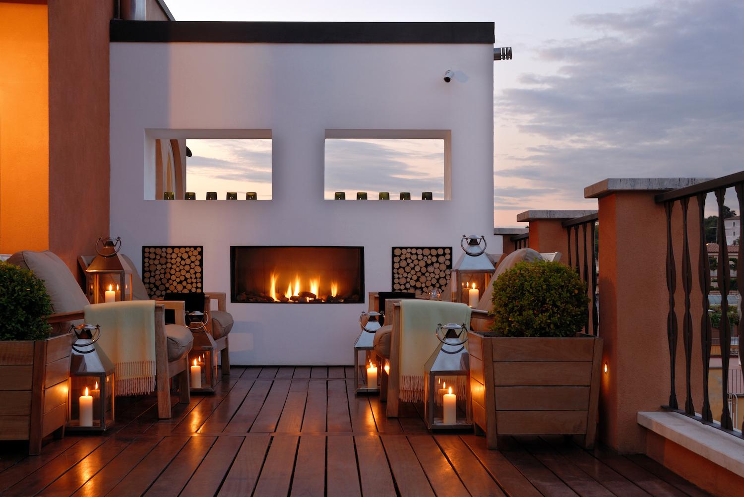 Portrait Roma Junior Suite split-level interior with private bar and marble finishes