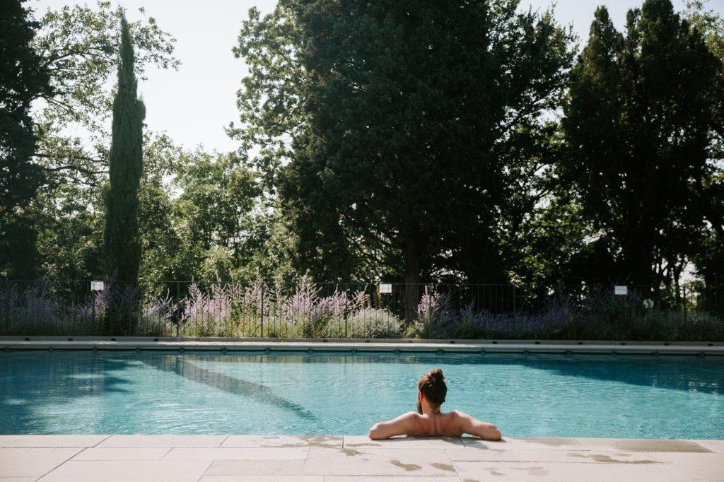 Panoramic outdoor swimming pool overlooking the hills and vineyards at Relais Roncolo 1888