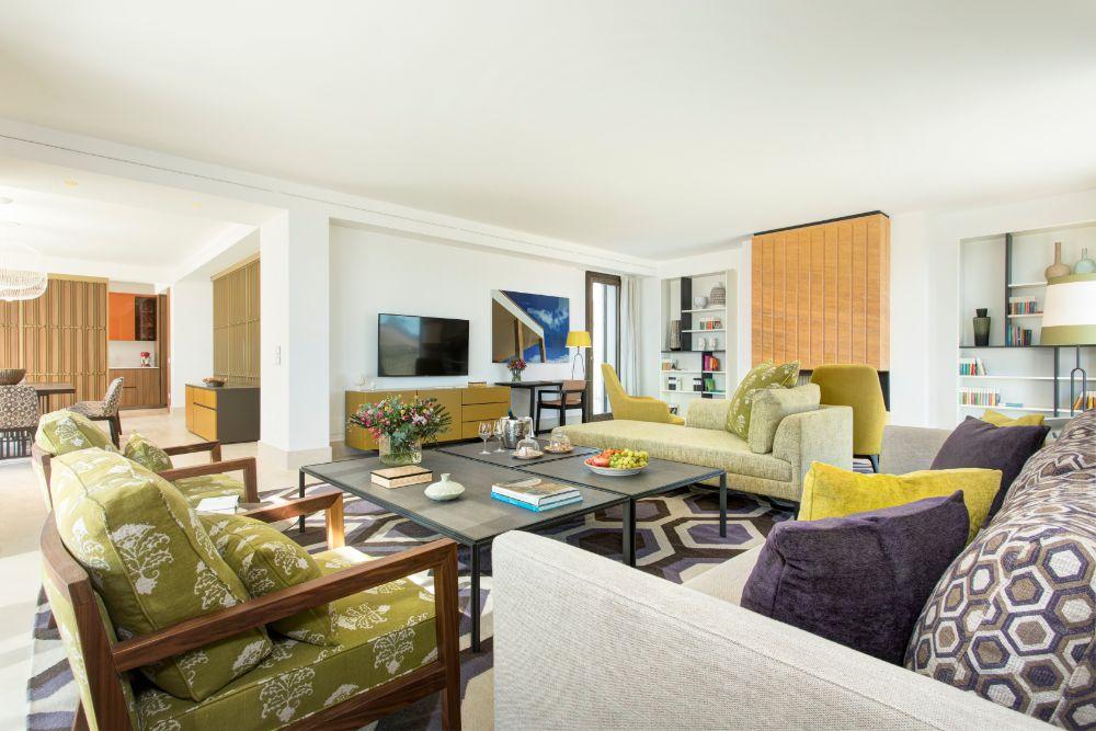 Airy double-height living room salon with bespoke Sicilian accents designed by Olga Polizzi