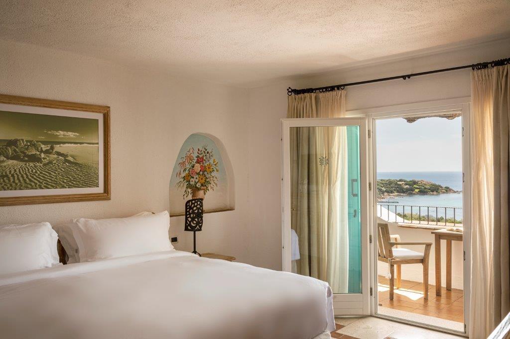 Opulent Smeralda Suite salon with handcrafted Sardinian furnishings and private terrace