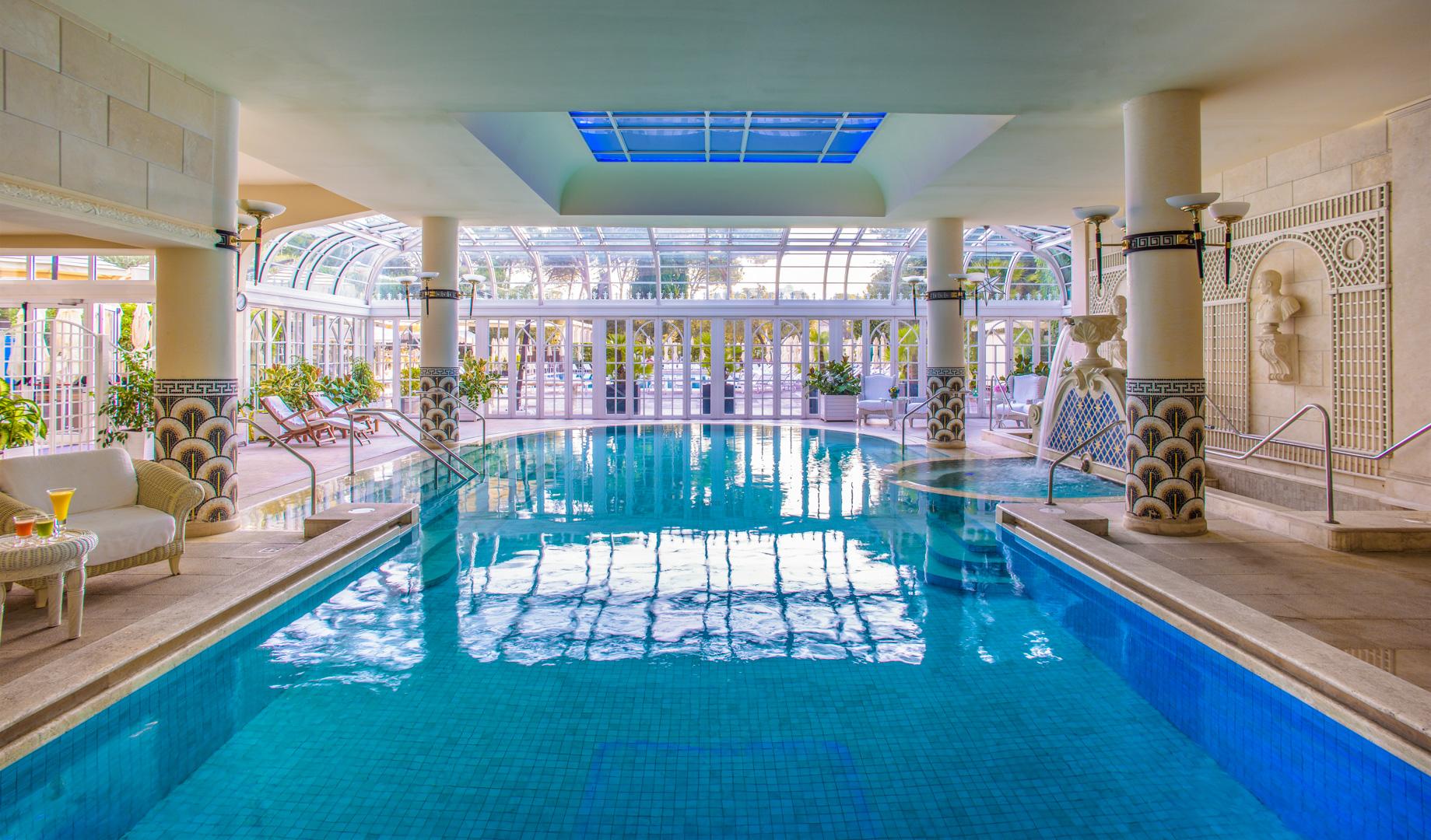 Colonnaded indoor pool and Roman baths at the award-winning Cavalieri Grand Spa Club