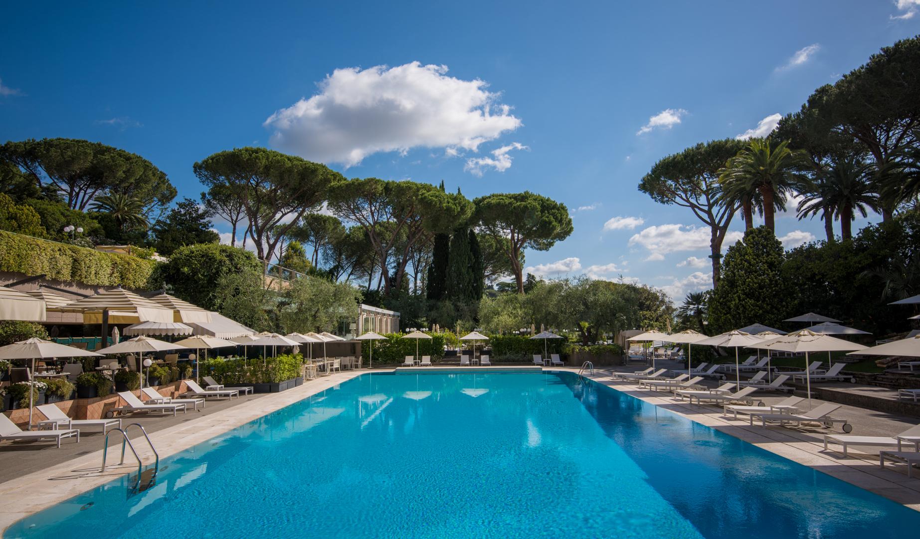 Heated outdoor swimming pool within the 15-acre private Mediterranean parkland at Rome Cavalieri