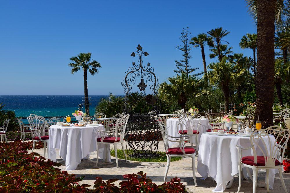 Guests enjoying al fresco breakfast and gourmet dining on the panoramic garden terrace