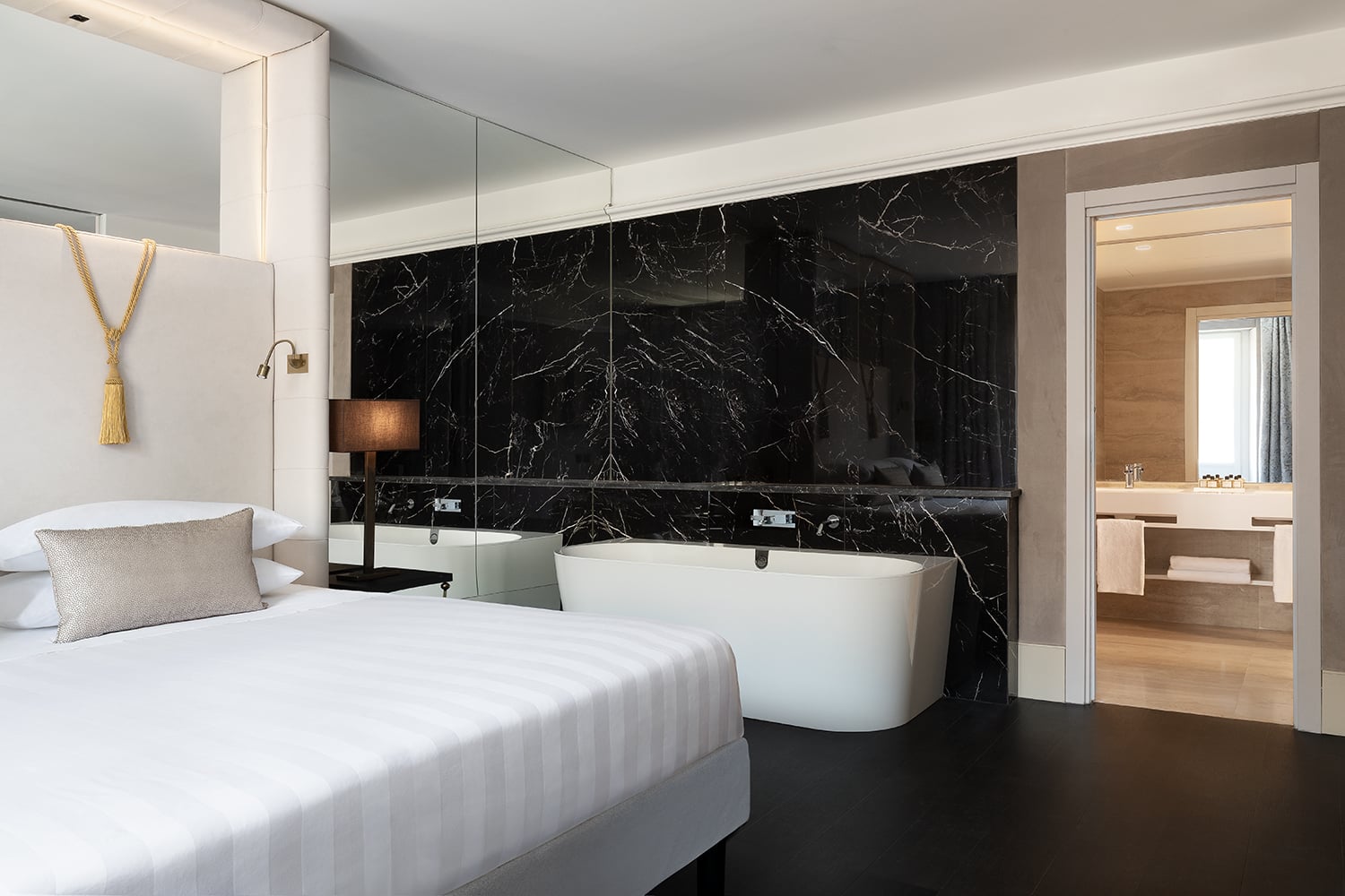 Signature Suite marble bathroom with freestanding soaking tub