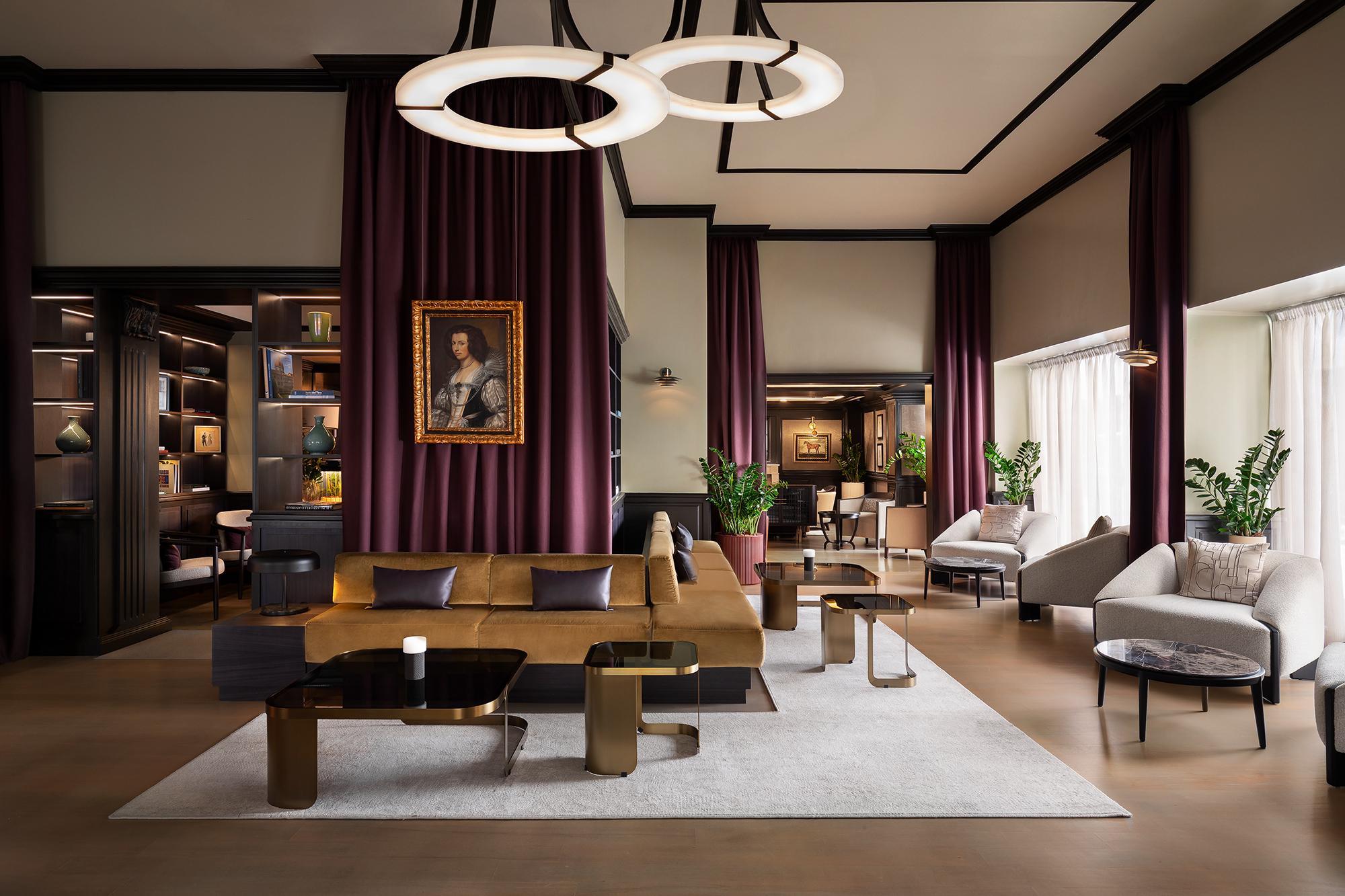 Elegant lobby lounge with classical decor and cozy velvet armchairs