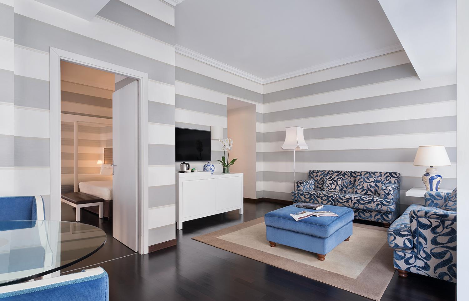 Opulent master suite with rich silk fabrics and separate living area