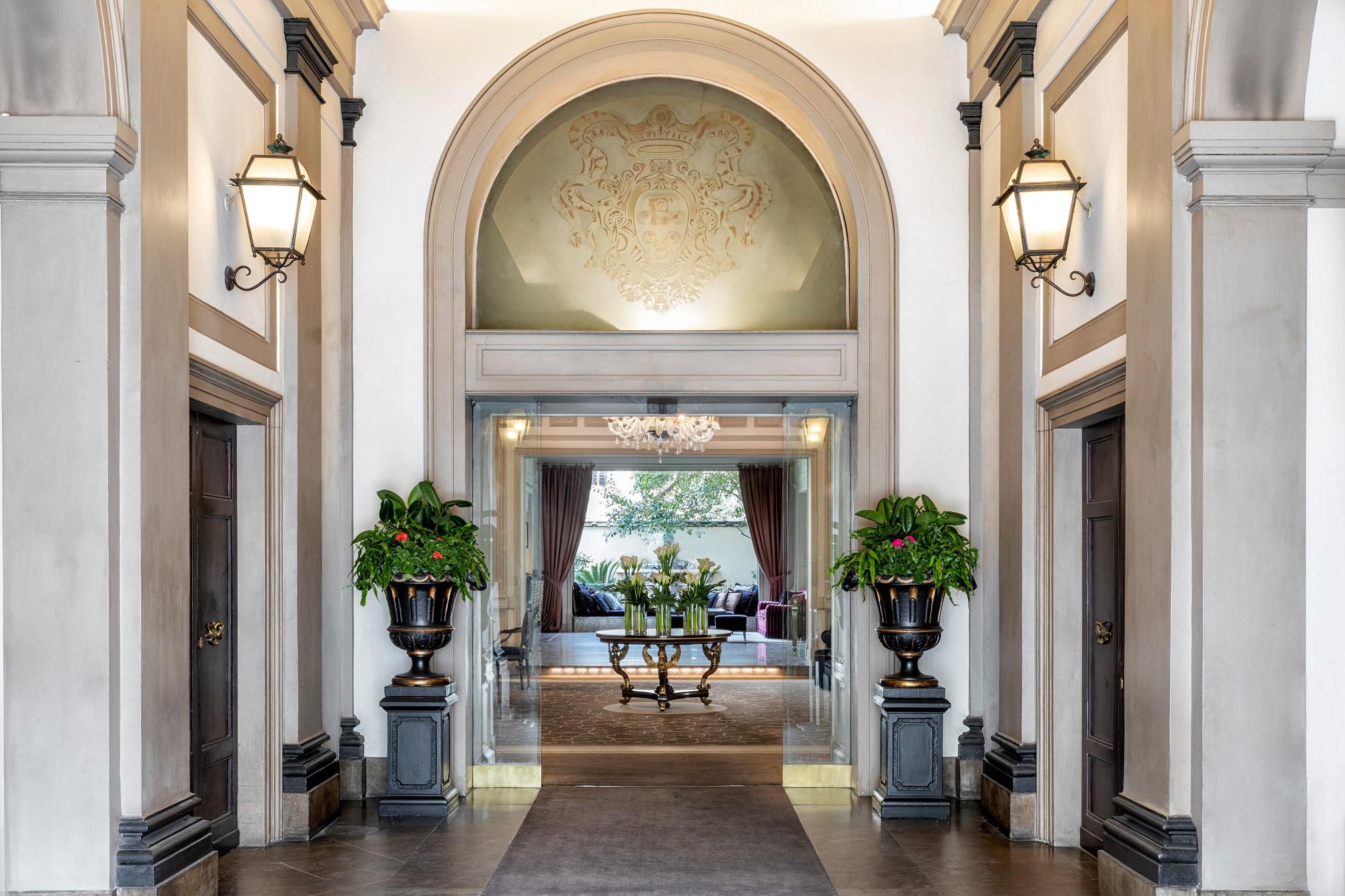 Grand 19th-century palazzo entrance with neo-classical architecture