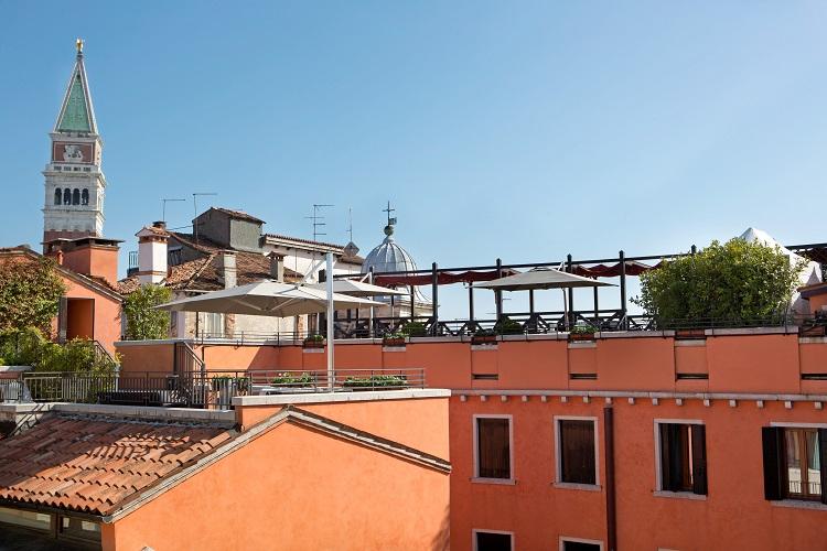 Traditional Venetian Altana rooftop terrace with views across historic rooftops
