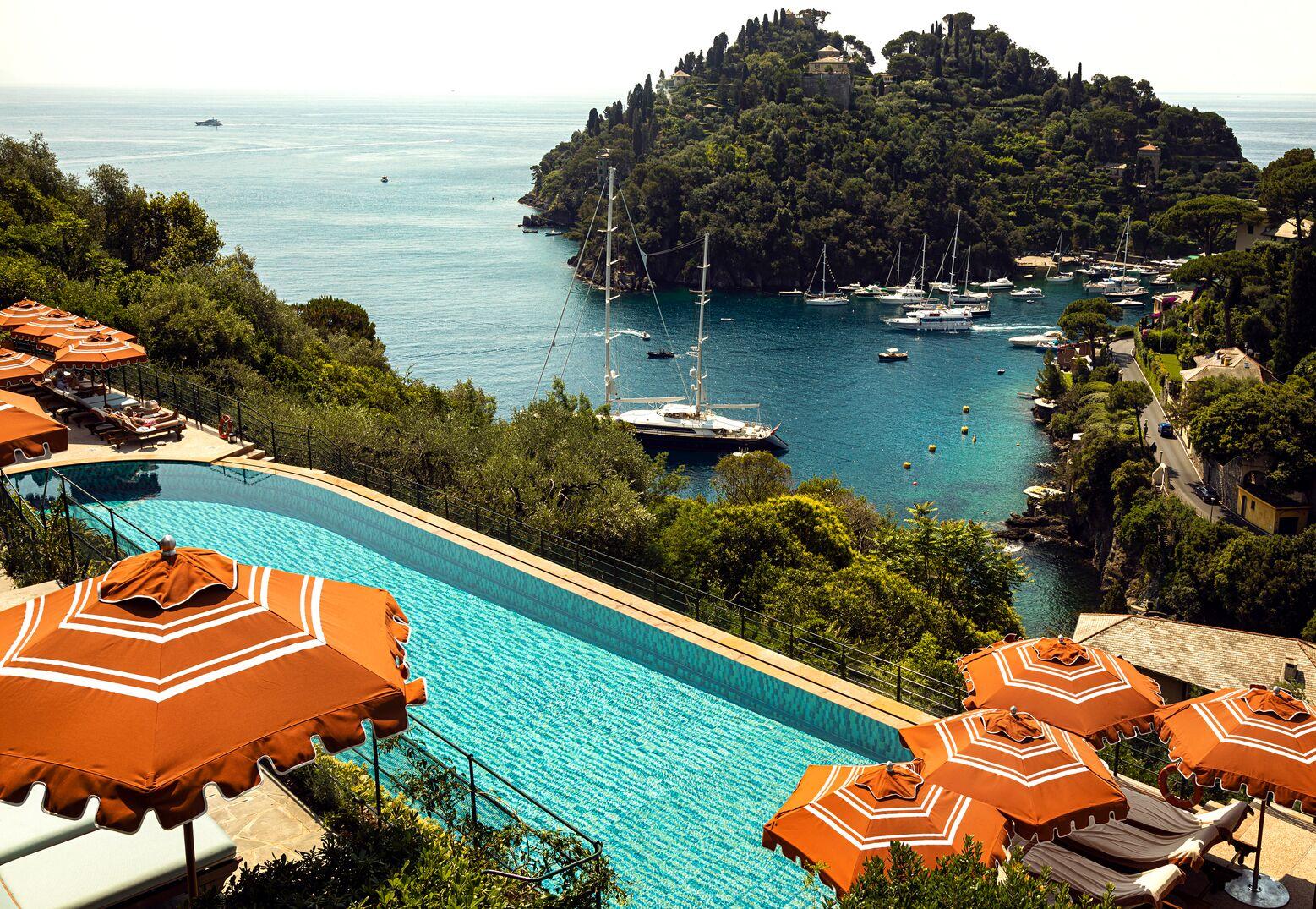 Iconic heated saltwater infinity swimming pool carved into the cliffs