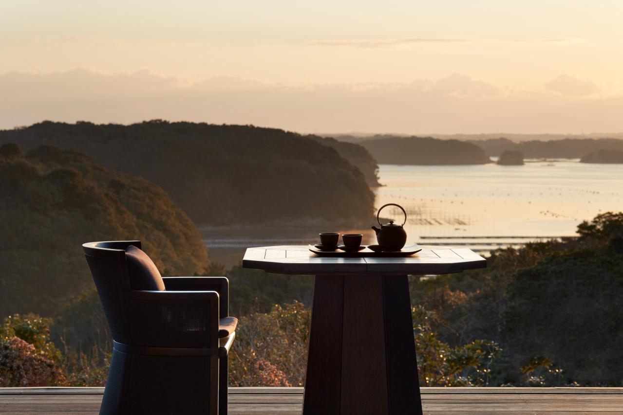 Expansive Outdoor Timber Veranda with Daybeds Framing Ago Bay Waters