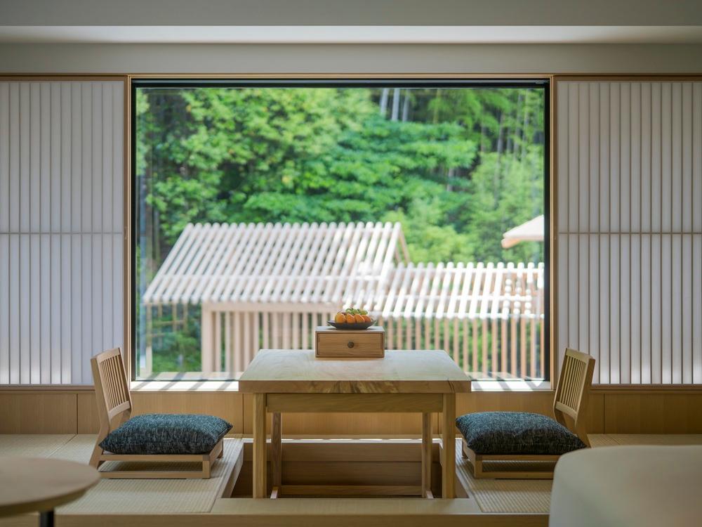 Onsen Retreat Bedroom Featuring Woven Tatami Mats and Panoramic Bamboo Views