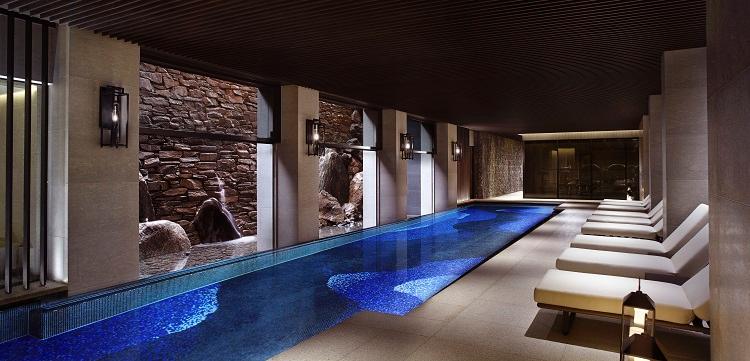 Subterranean 20-Meter Heated Indoor Swimming Pool with Cascading Illuminated Waterfall