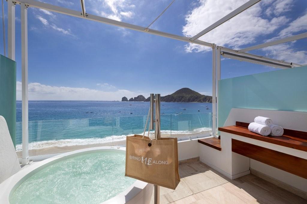 Extra ME+ Junior Suite with oceanfront terrace and modern luxury furnishings