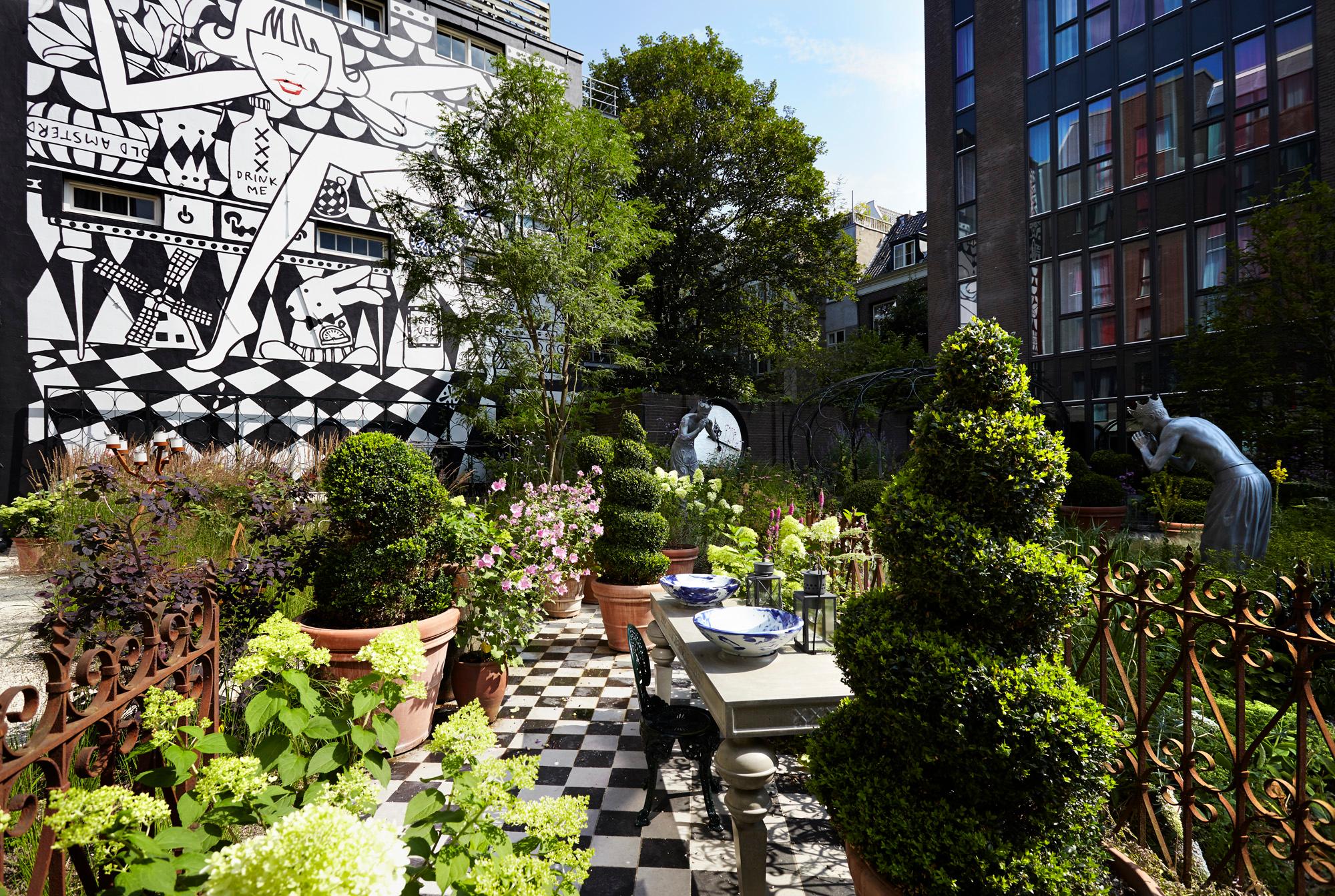 The private landscaped secret garden with Marcel Wanders sculptures and open-air seating