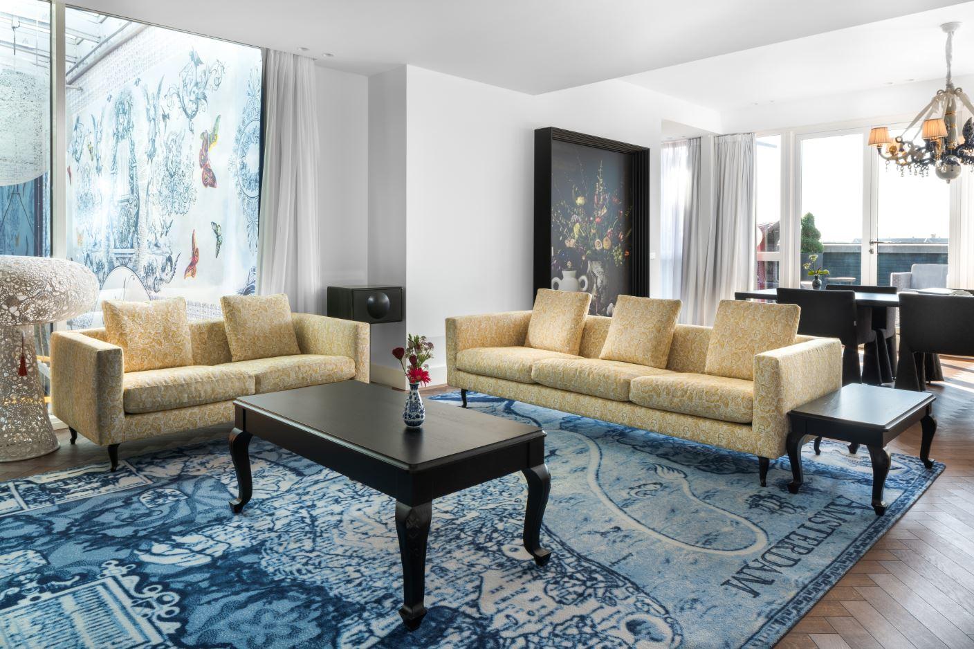 The residential Prinsengracht Suite living salon featuring bespoke Marcel Wanders artwork and canal views
