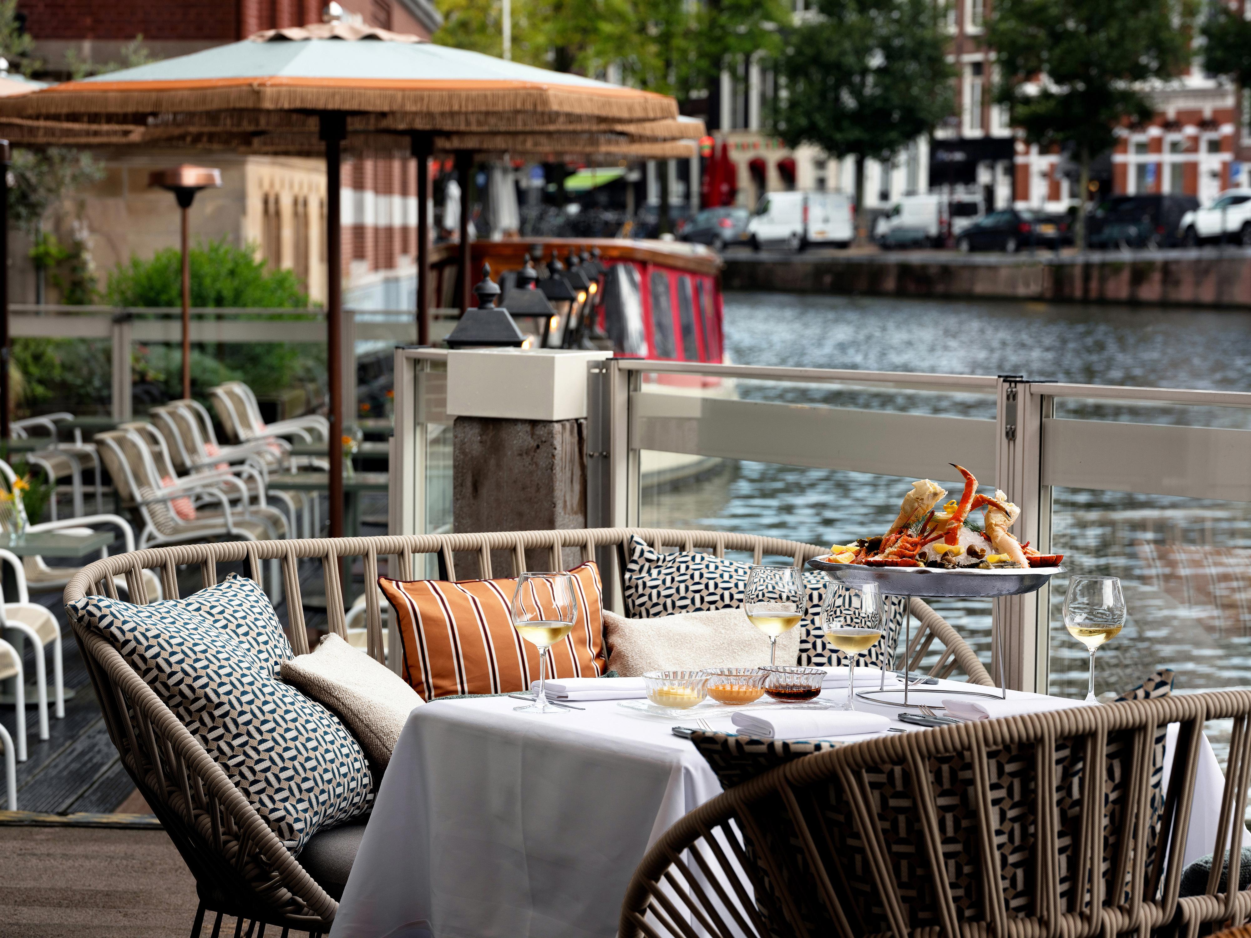 Brasserie Marie waterside terrace Marie Sur L'Eau overlooking Amsterdam boats and historic canals